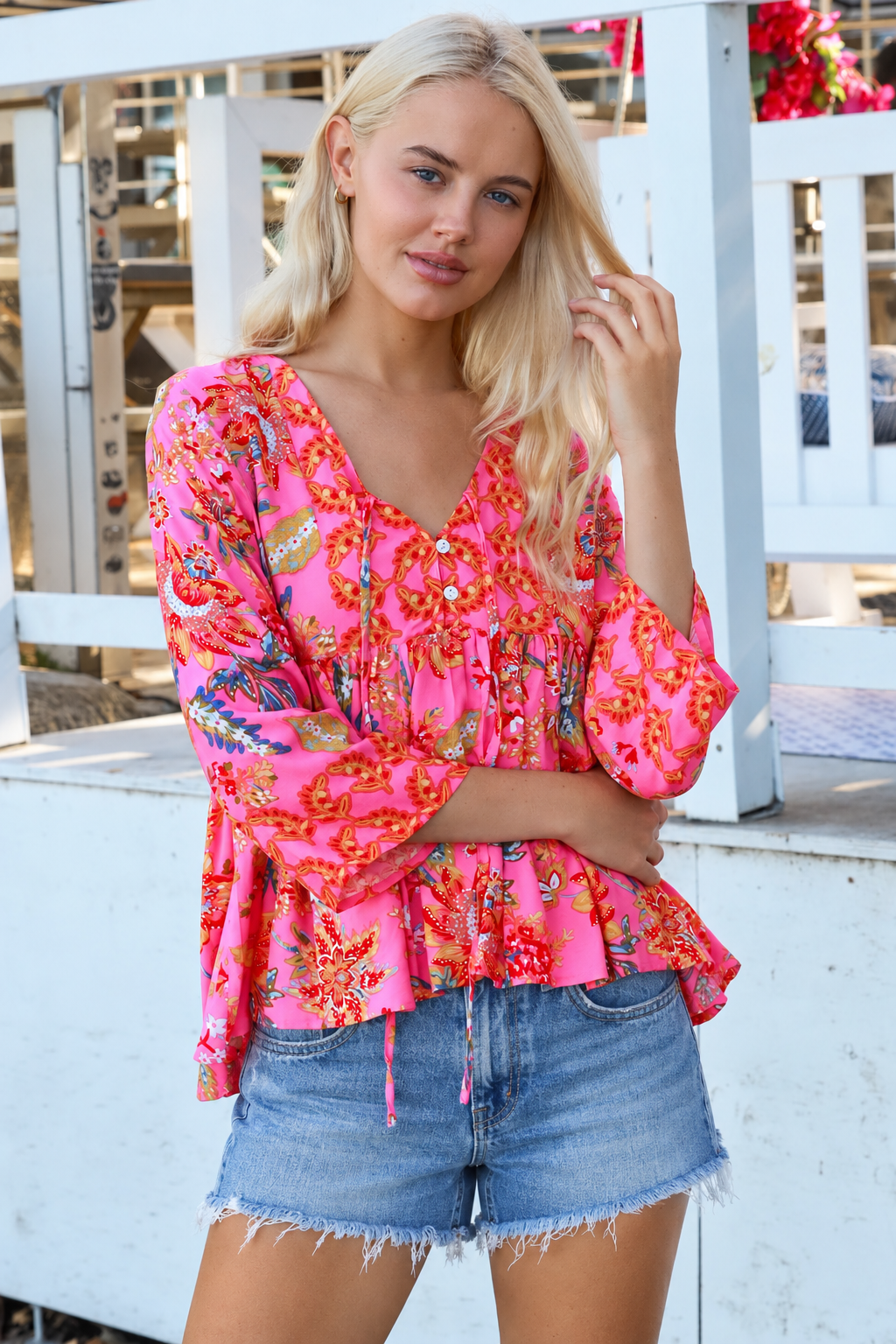 Sintra pink floral boho top with V-neck, button front, ties and three-quarter bell sleeves