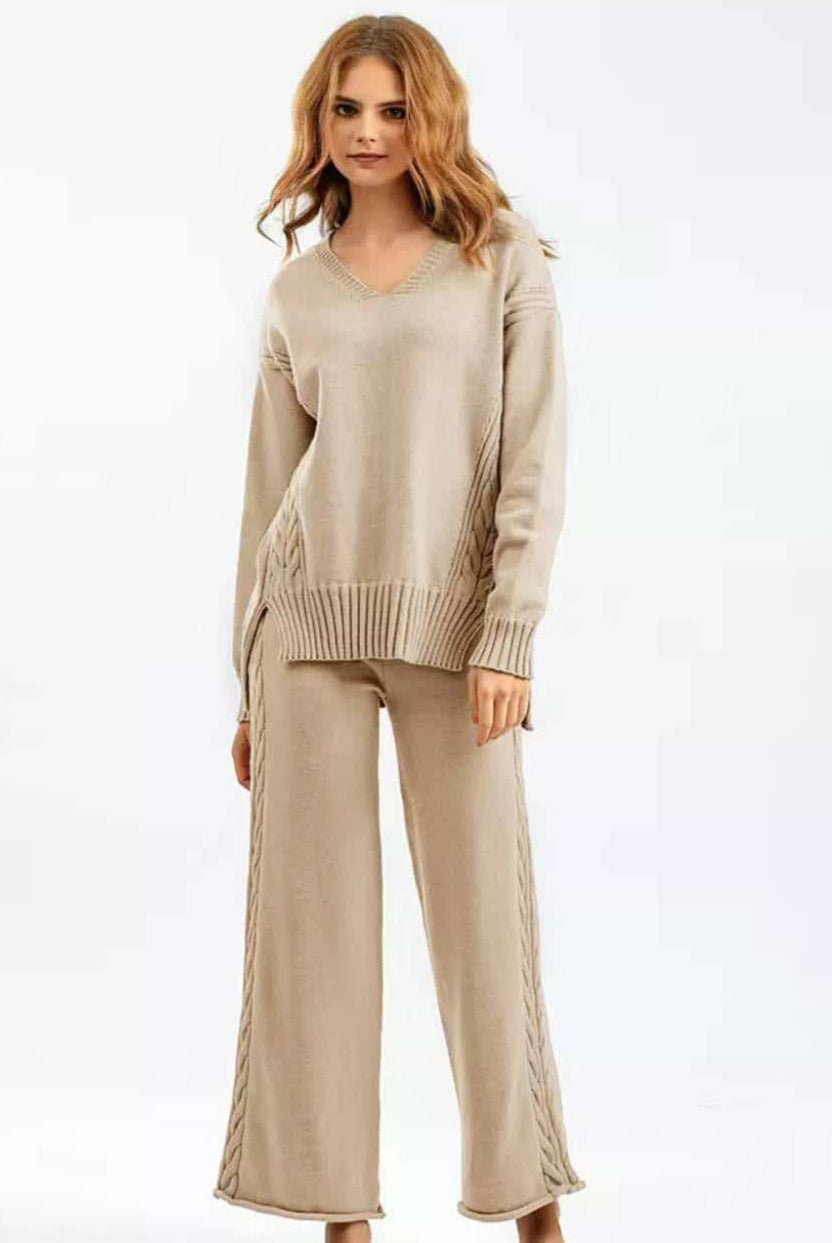 Woman wearing beige cotton cable knit lounge set with relaxed V-neck sweater and wide-leg pants - cozy boho loungewear Australia.