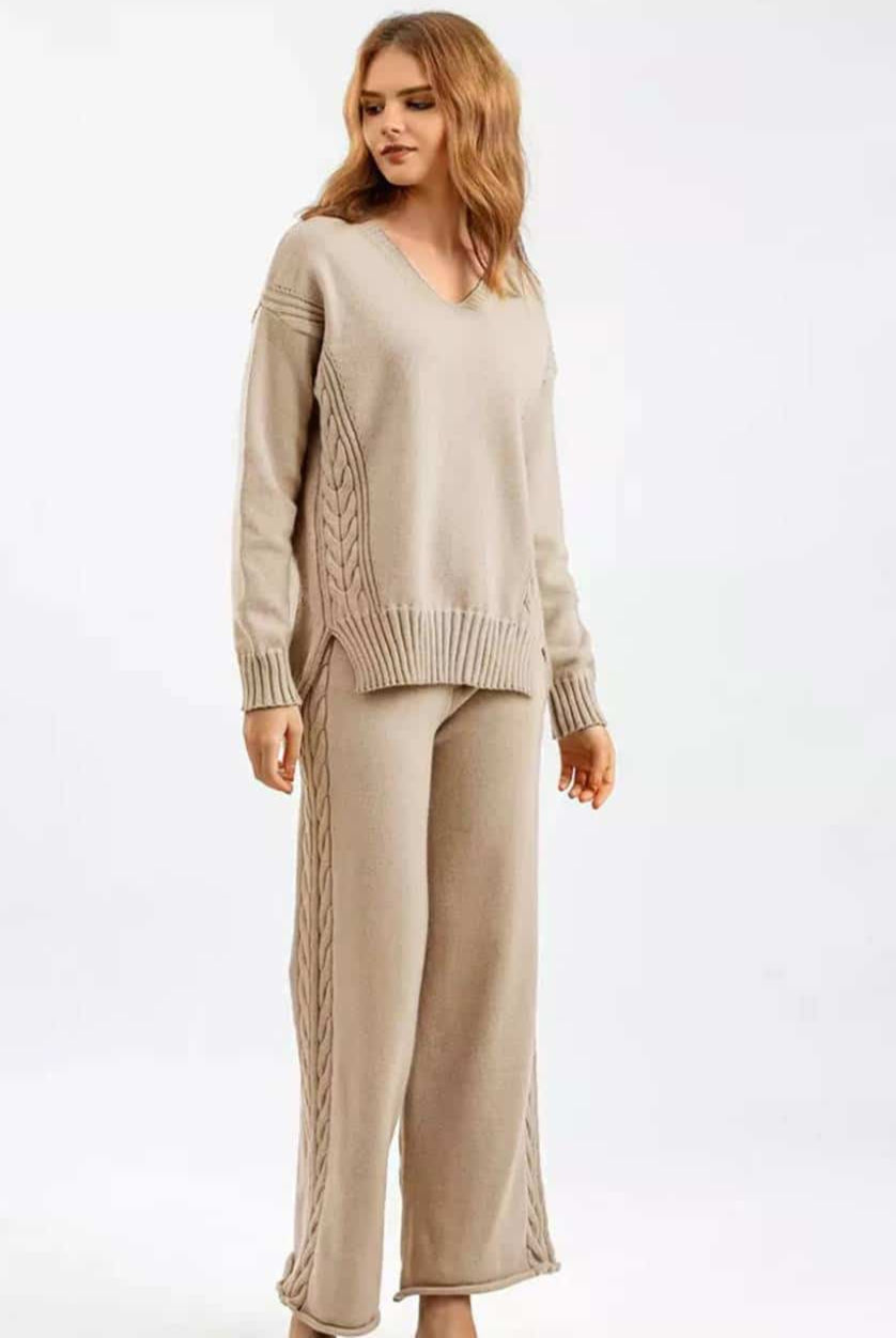 Woman wearing beige cotton cable knit lounge set with relaxed V-neck sweater and wide-leg pants - cozy boho loungewear Australia.