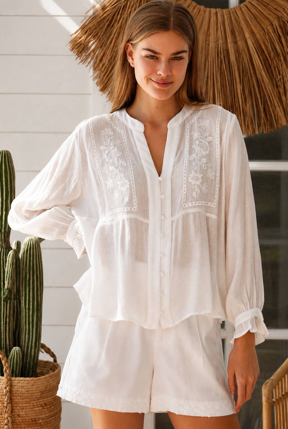 Paige white embroidered blouse by Salty Palm with floral panels, split neckline and long relaxed sleeves