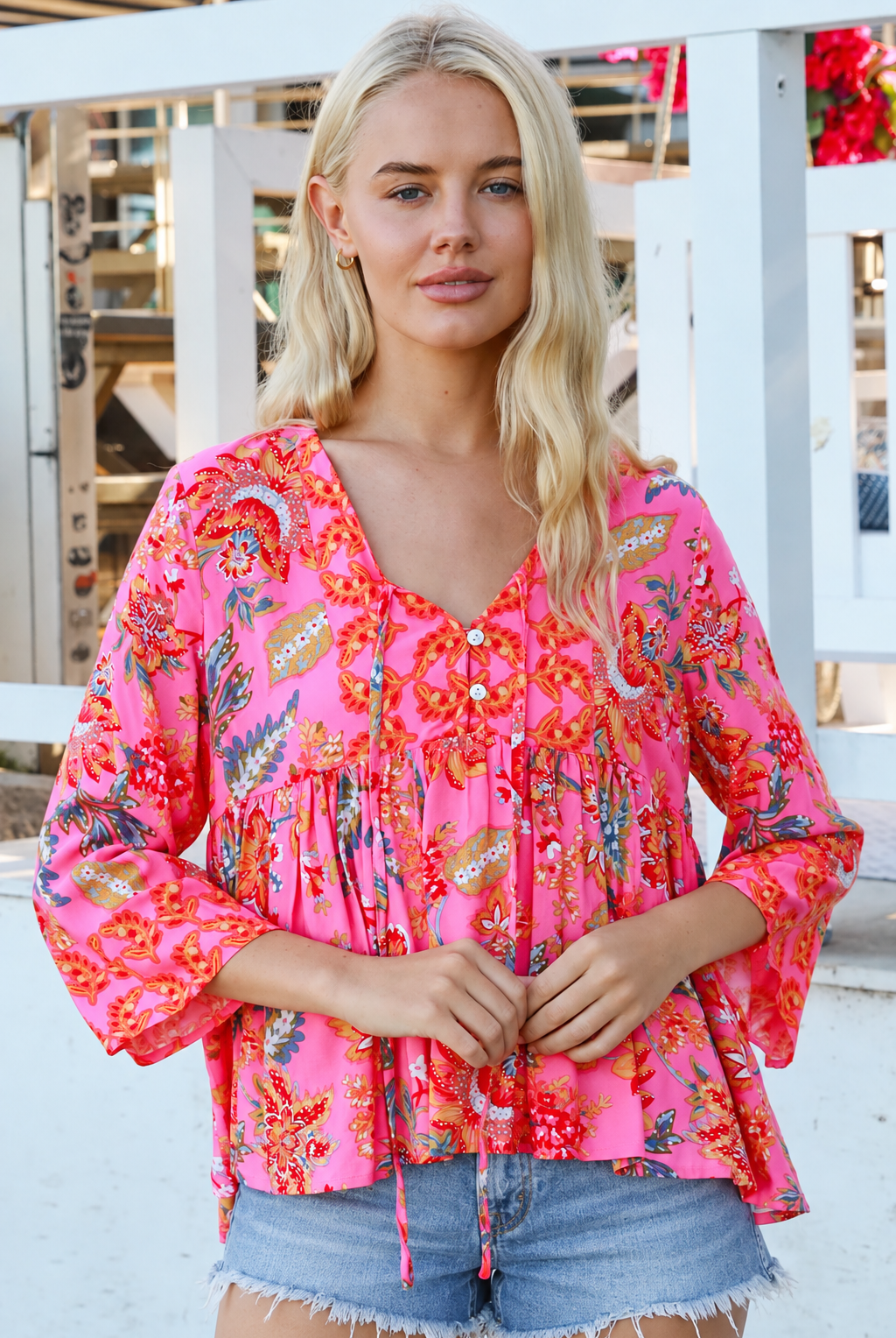 Sintra pink floral boho top with V-neck, button front, ties and three-quarter bell sleeves