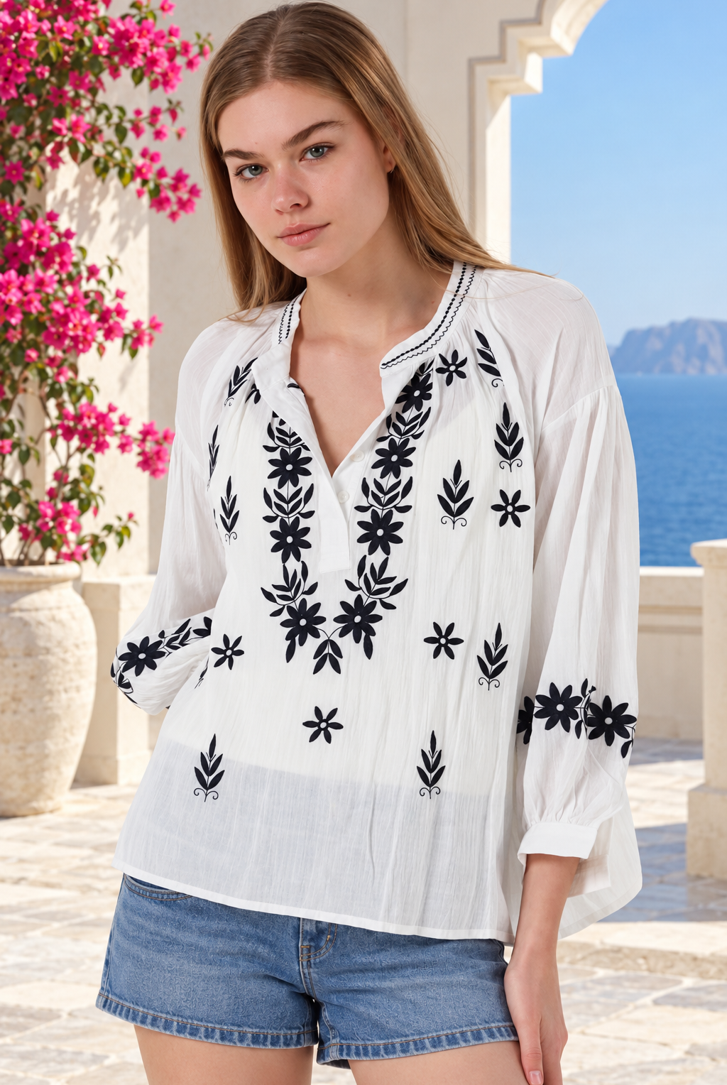 White Salty Palm cotton blouse with navy floral embroidery, V-neck button front, gathered long sleeves and stitched cuffs