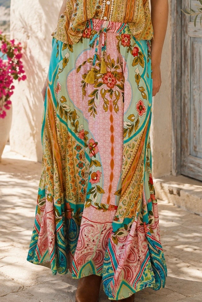 Amara floral boho maxi skirt in 100% rayon with colourful placement print, gathered frill hem and tassel tie