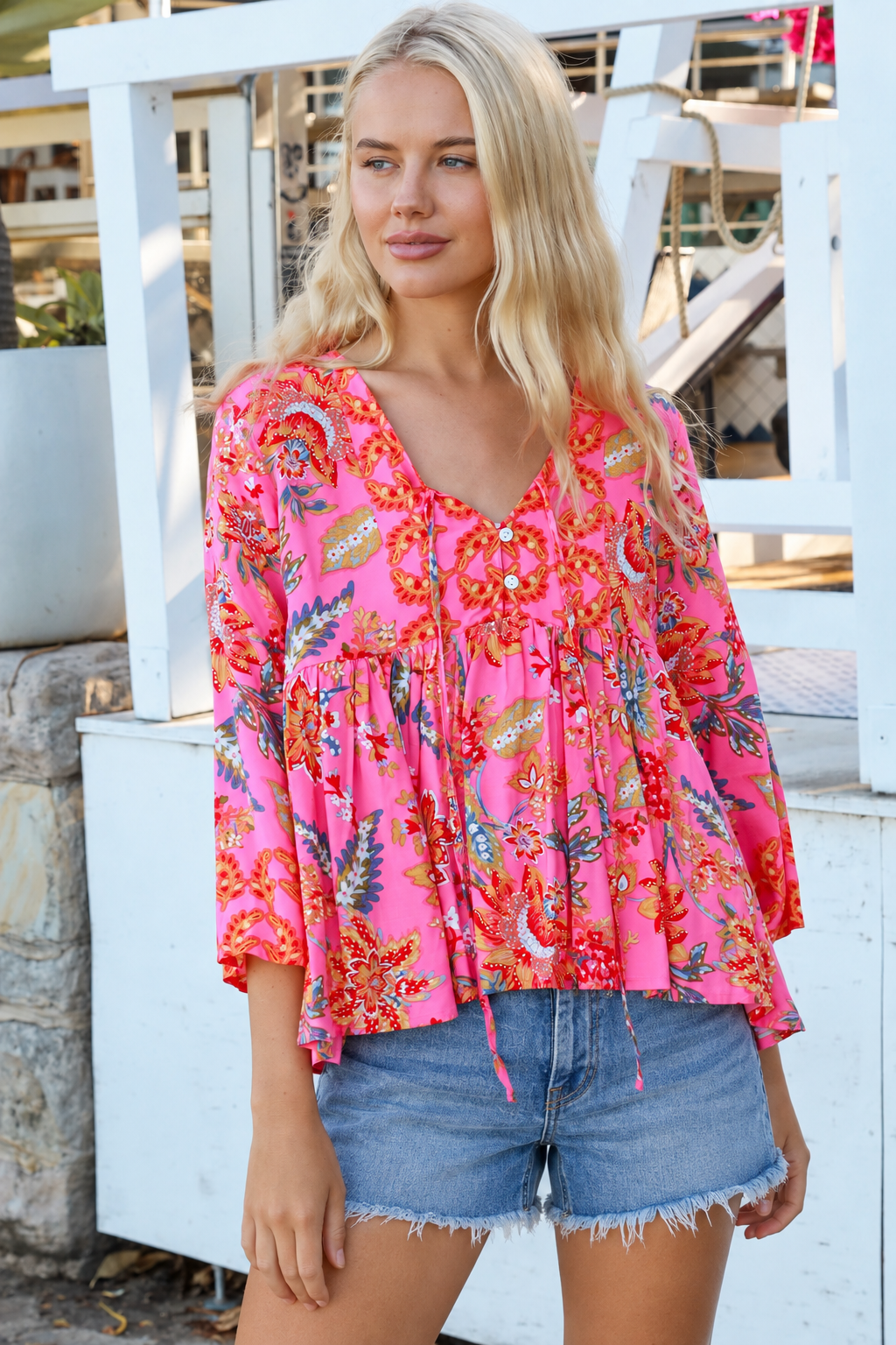 Sintra pink floral boho top with V-neck, button front, ties and three-quarter bell sleeves