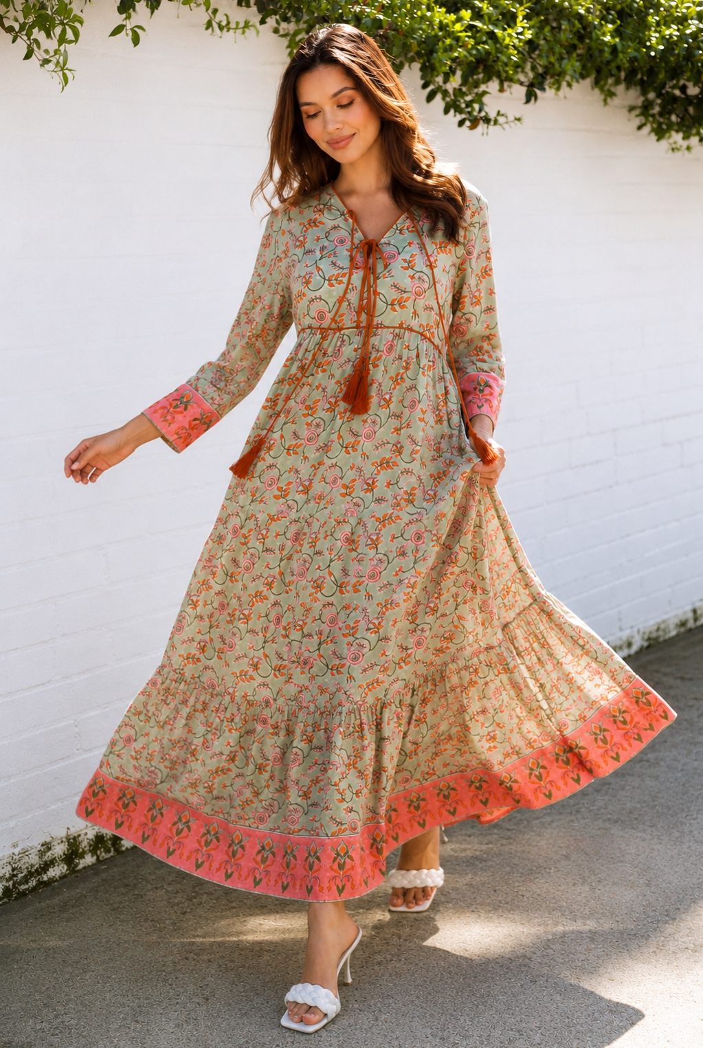 Lauren 100% cotton floral boho maxi dress in sage green with coral botanical print, tassel ties and contrast border hem