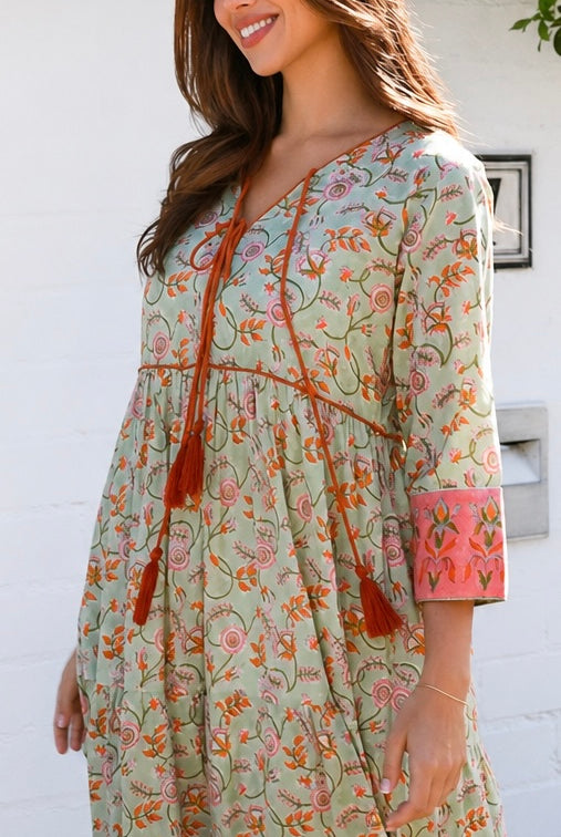 Lauren 100% cotton floral boho maxi dress in sage green with coral botanical print, tassel ties and contrast border hem