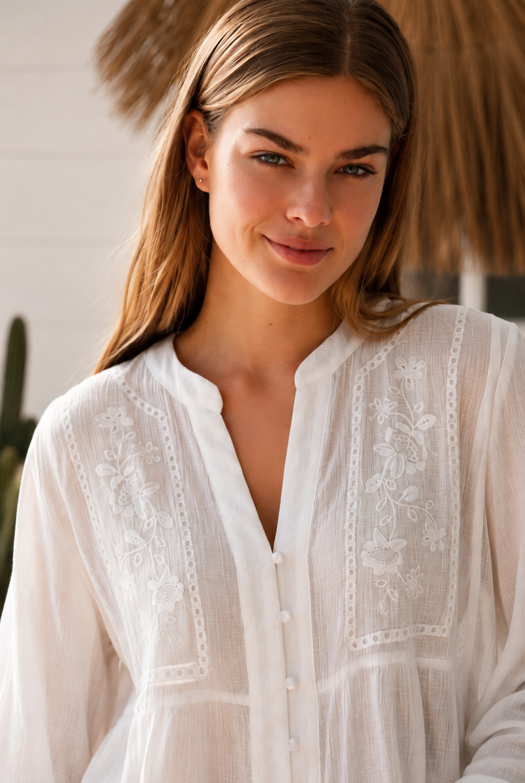 Paige white embroidered blouse by Salty Palm with floral panels, split neckline and long relaxed sleeves