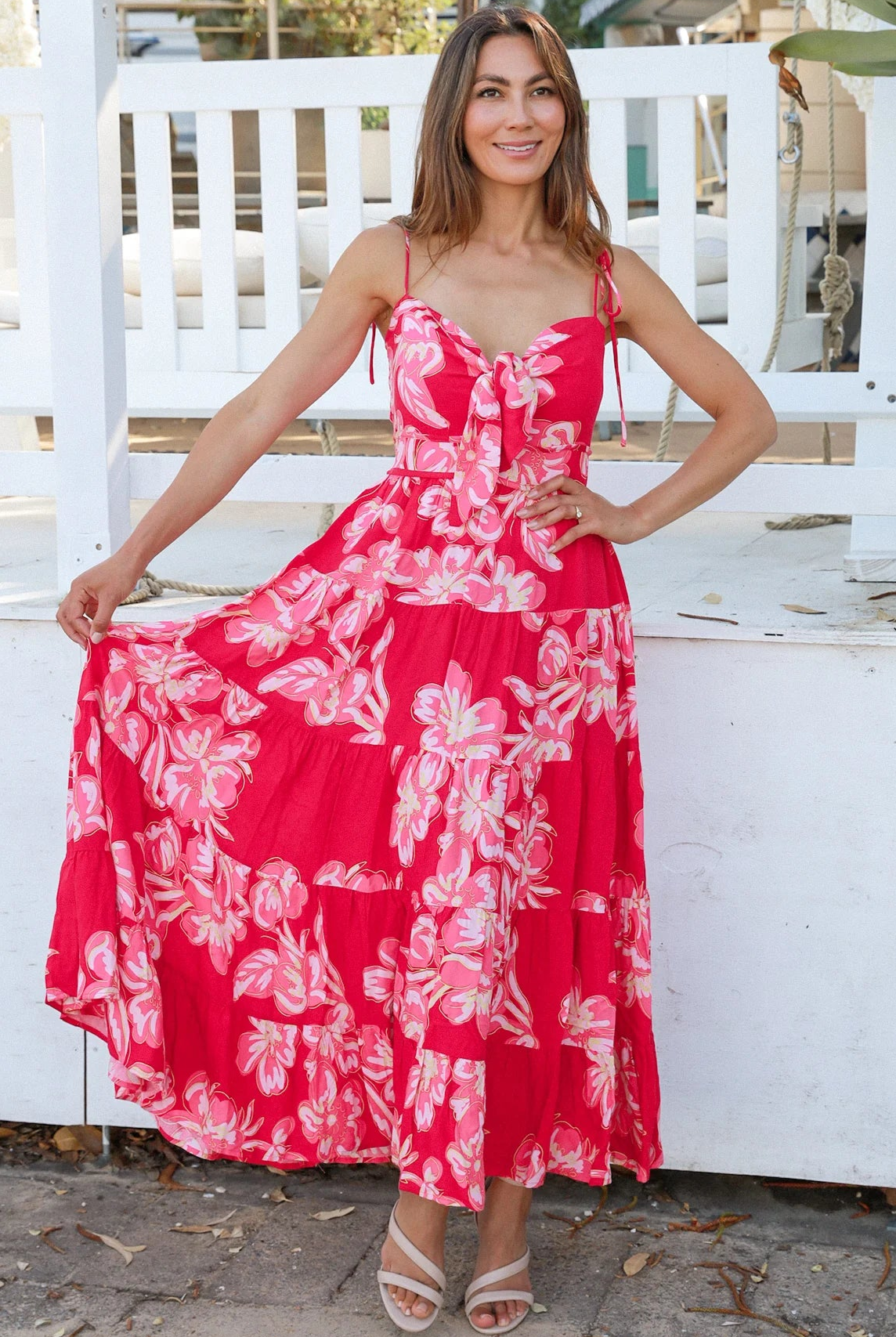 Woman wearing the Zaria Rose Maxi red floral boho maxi dress with tie straps - romantic summer fashion Australia.
