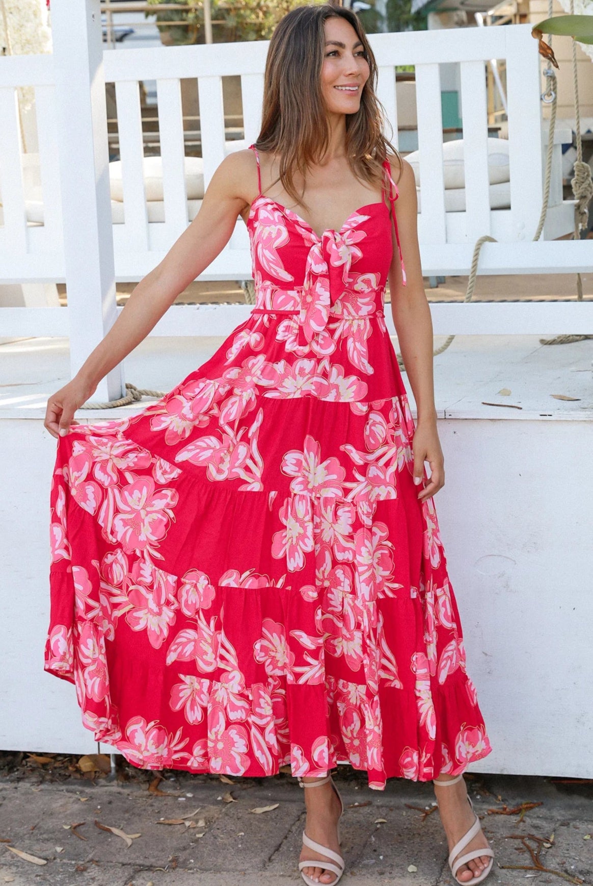 Woman wearing the Zaria Rose Maxi red floral boho maxi dress with tie straps - romantic summer fashion Australia.