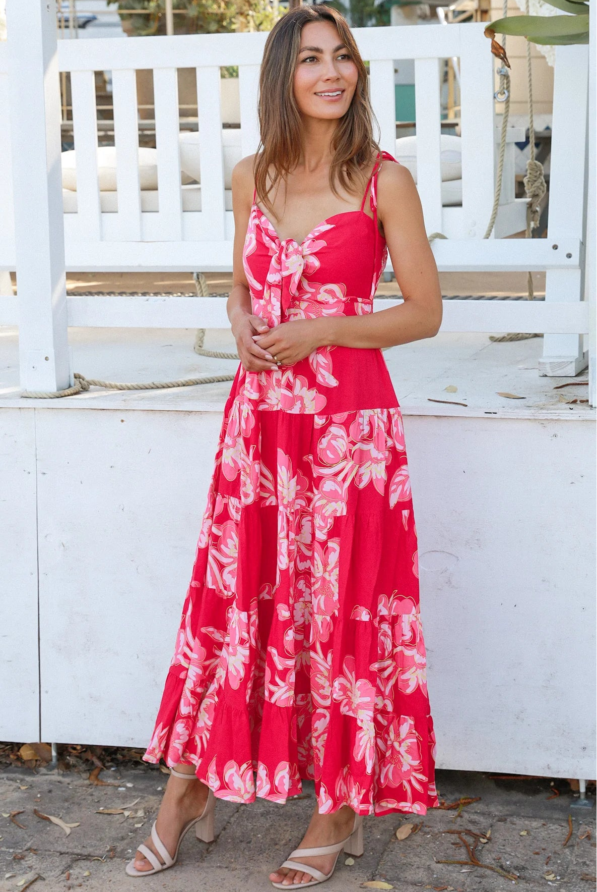 Woman wearing the Zaria Rose Maxi red floral boho maxi dress with tie straps - romantic summer fashion Australia.