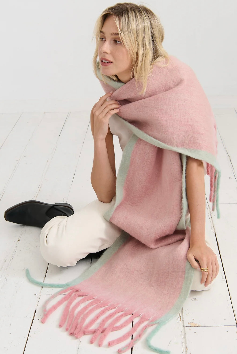 Woman in a blush pink and pastel green winter scarf with brushed texture from Bohemian Love Runway