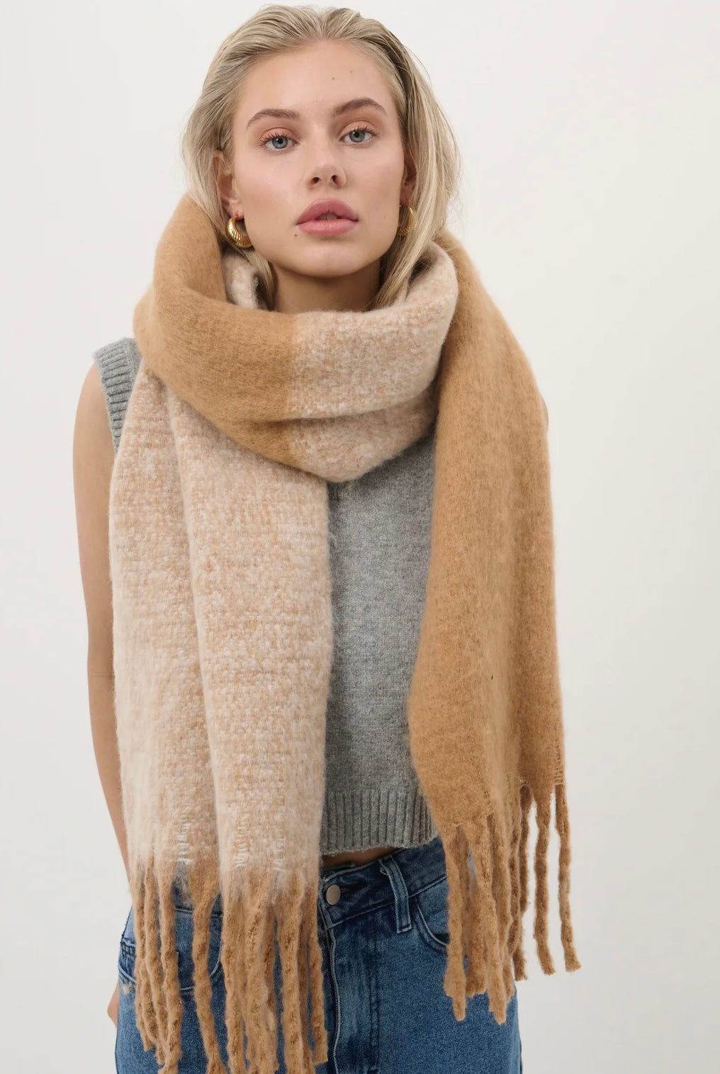 Woman wearing a caramel and beige fluffy boho scarf with fringe - Amber Light soft winter wrap by Bohemian Love Runway.