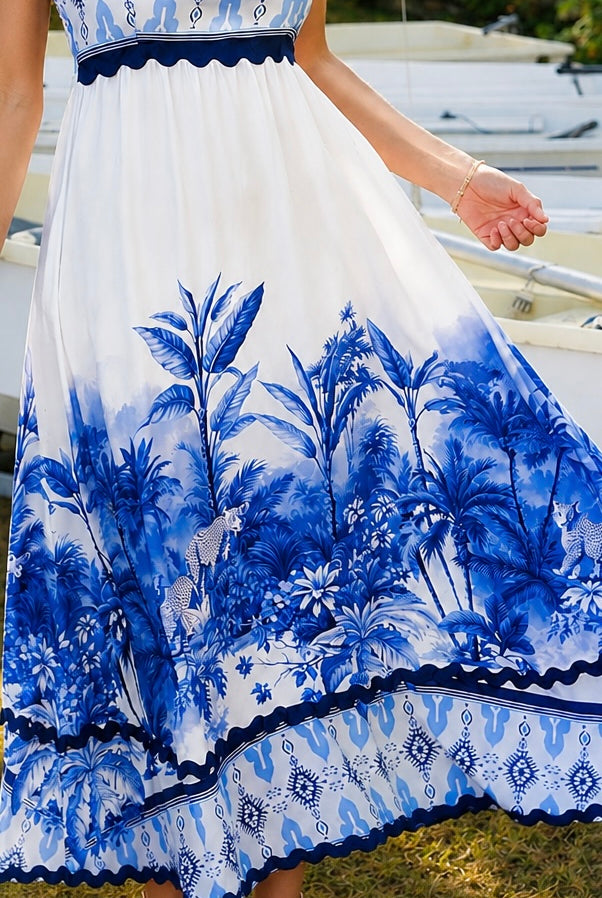 Blue and white floral boho maxi dress with statement border print at Bohemian Love Runway