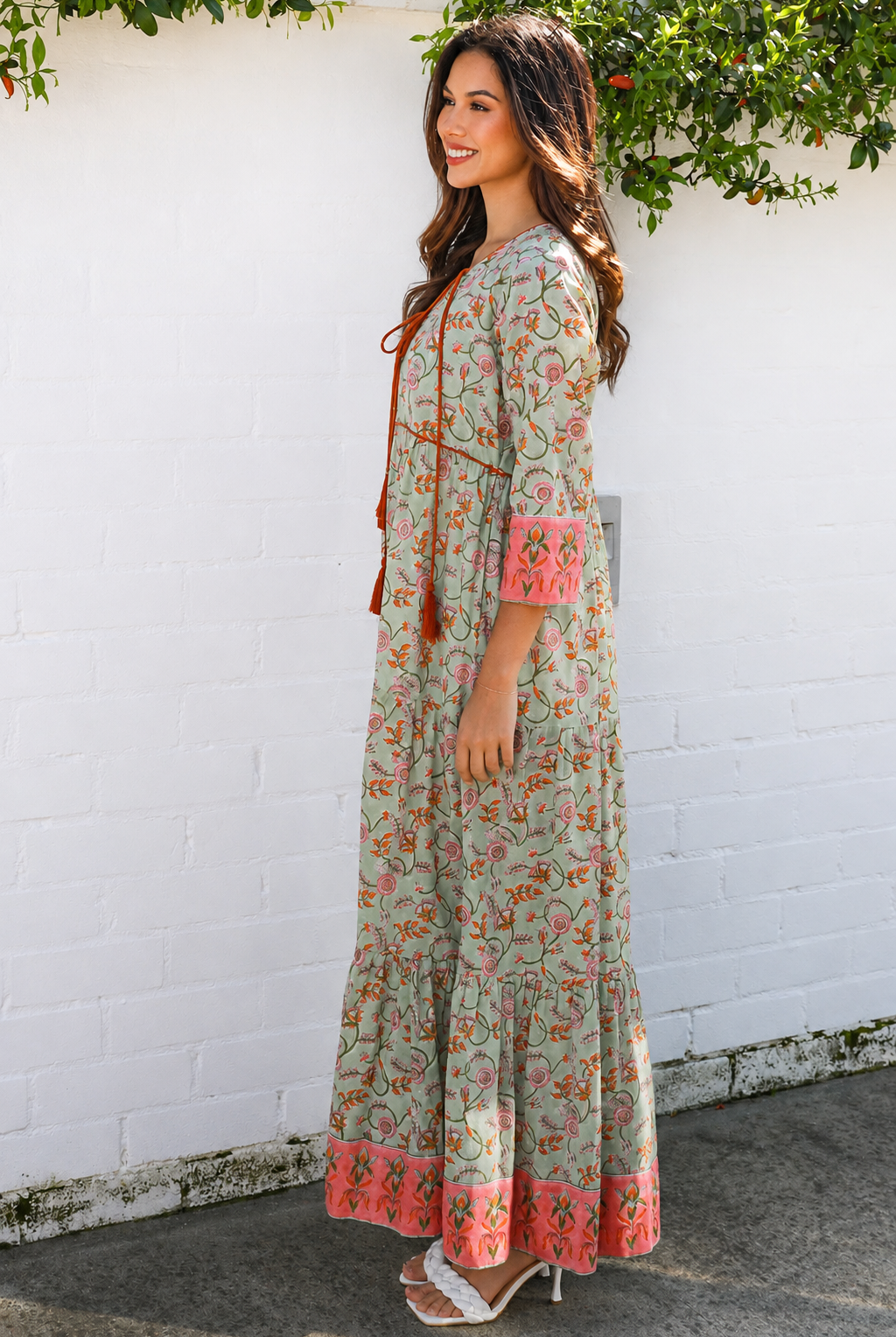 Lauren 100% cotton floral boho maxi dress in sage green with coral botanical print, tassel ties and contrast border hem