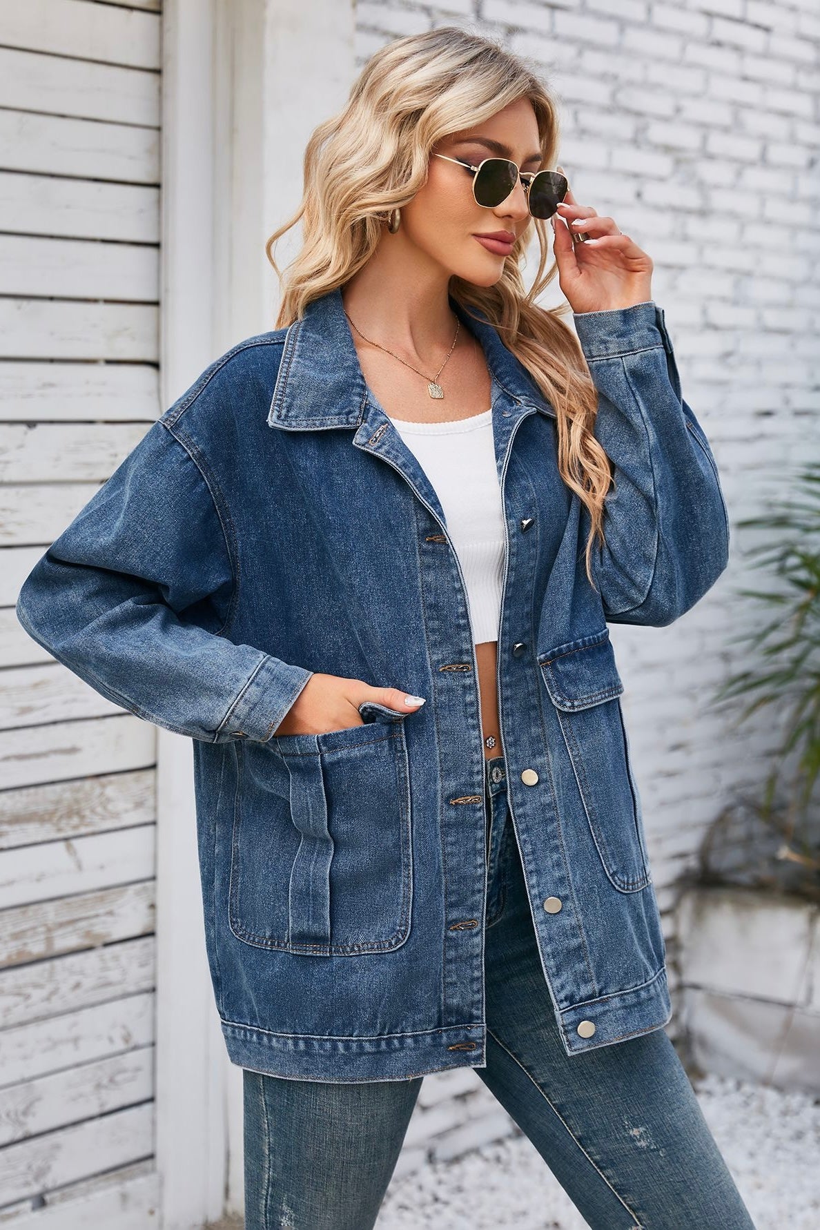 Oversized two-tone blue denim jacket with patch pockets worn over denim jeans - Bohemian Style Australia.