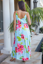 Woman wearing aqua floral v-neck maxi dress with pink and coral blooms – Charlotte the Label boho dresses Australia