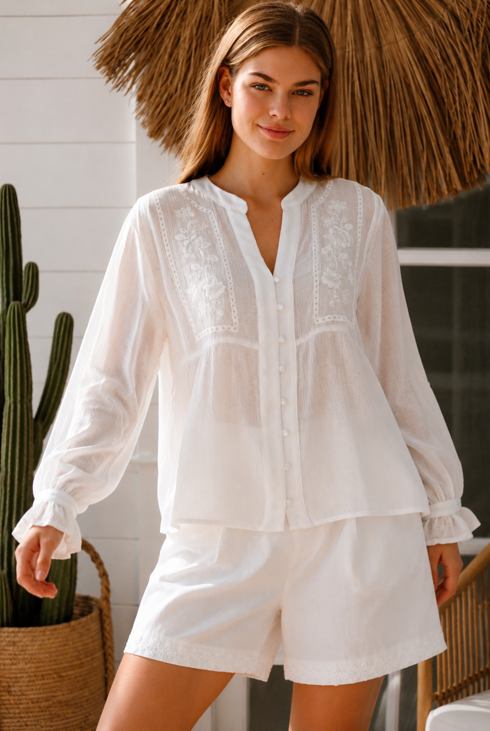 Paige white embroidered blouse by Salty Palm with floral panels, split neckline and long relaxed sleeves