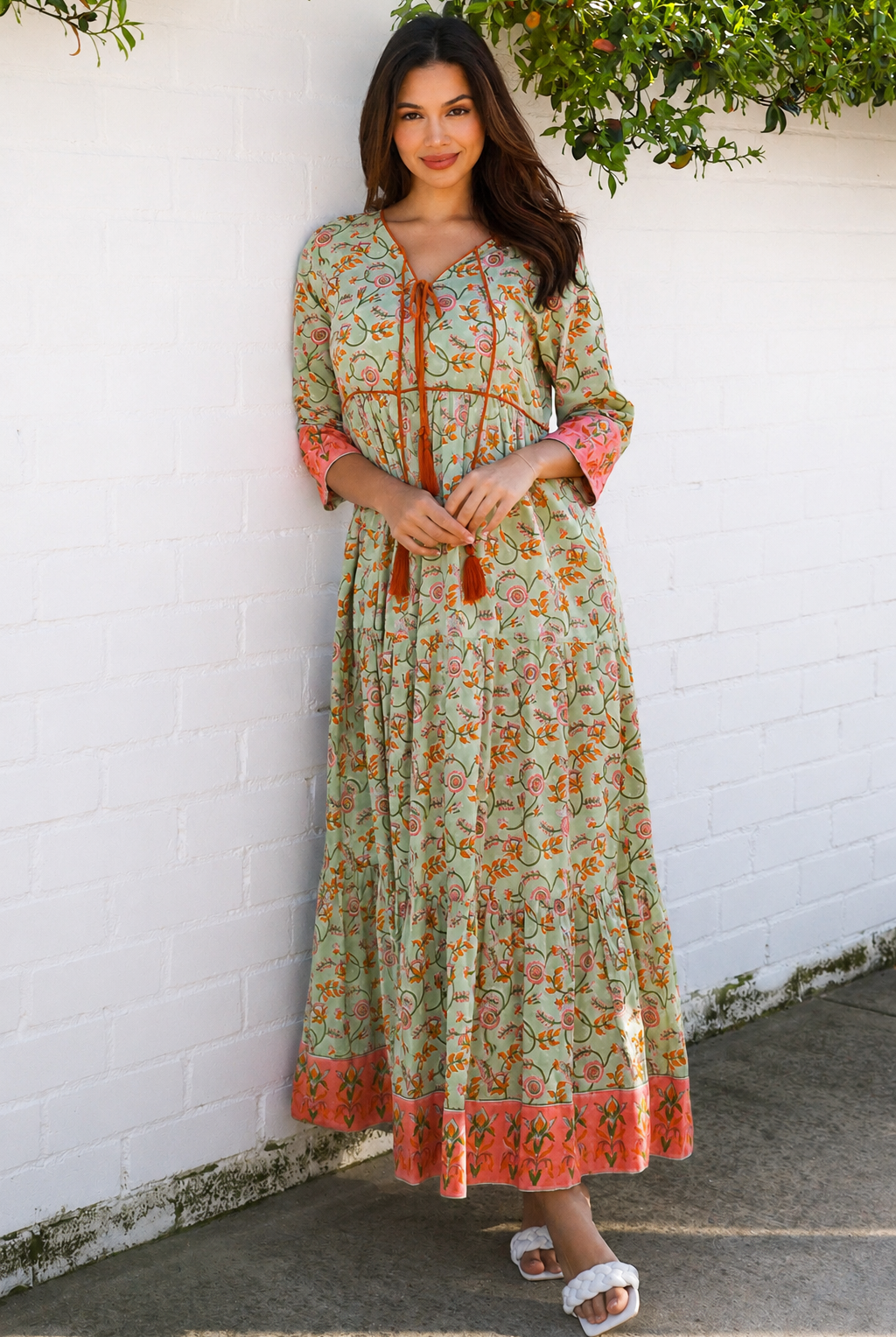 Lauren 100% cotton floral boho maxi dress in sage green with coral botanical print, tassel ties and contrast border hem