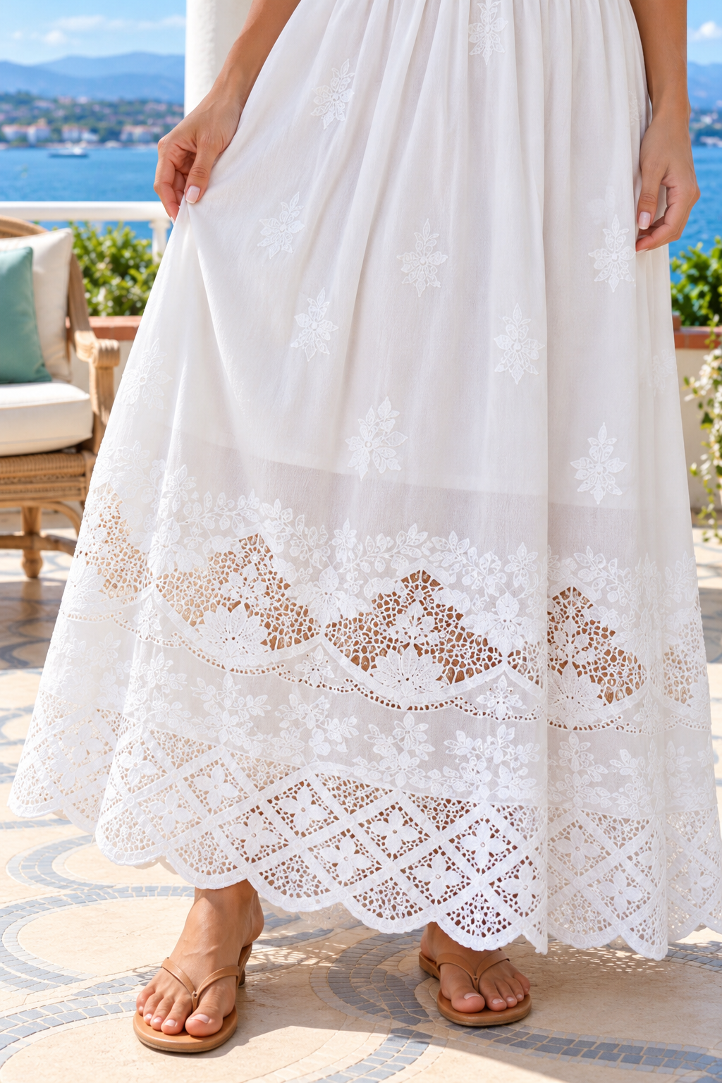 Lola white embroidered cotton maxi dress by Salty Palm featuring floral cutwork, adjustable straps, fitted waist and scalloped lace hem.