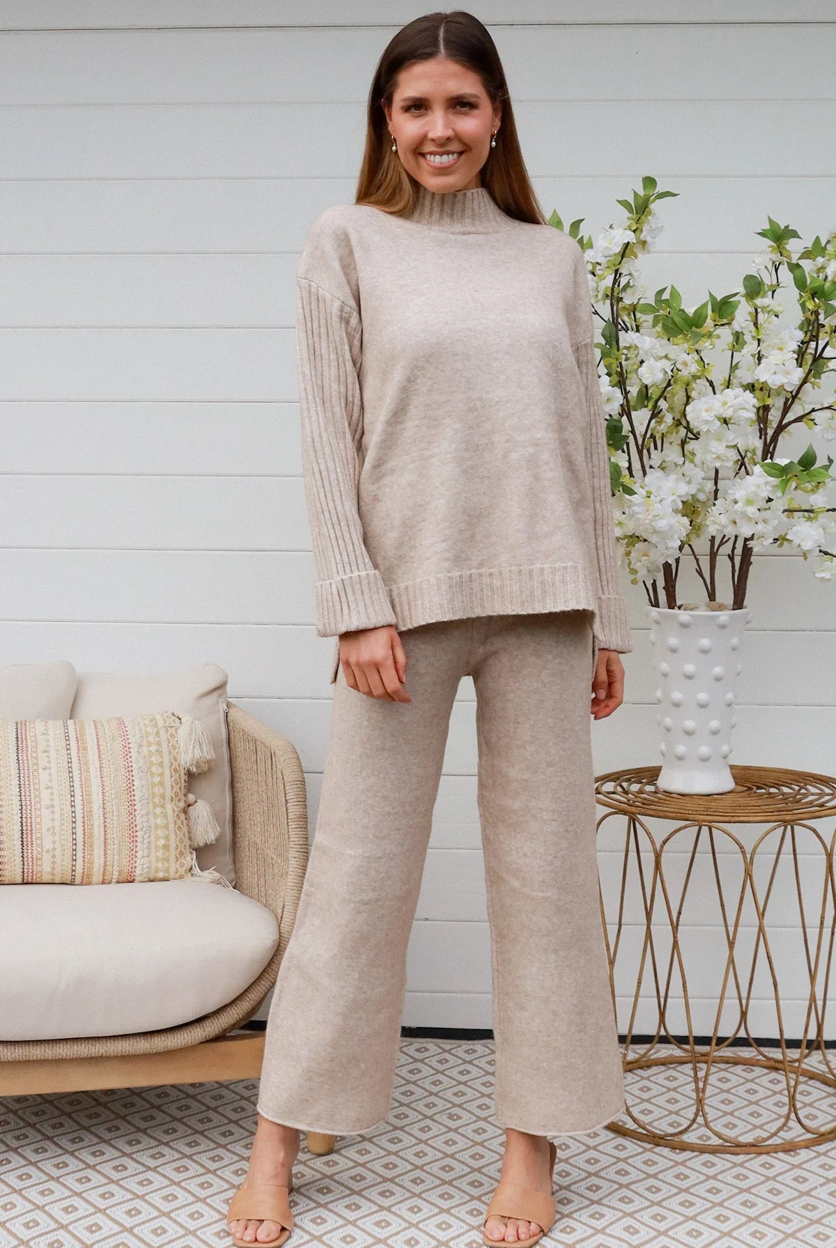 Woman in vanilla knit lounge set with ribbed sweater and wide-leg pants - boho knitwear co-ord set - Bohemian Love Runway.