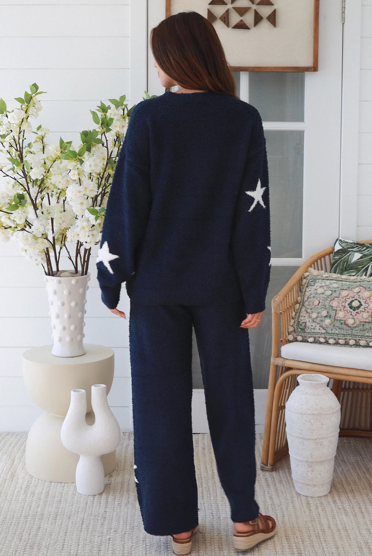 Charlotte The Label Star Soft Brushed Knit Pants in navy featuring a soft brushed knit, closely placed white star design, wide-leg silhouette and elastic waistband.