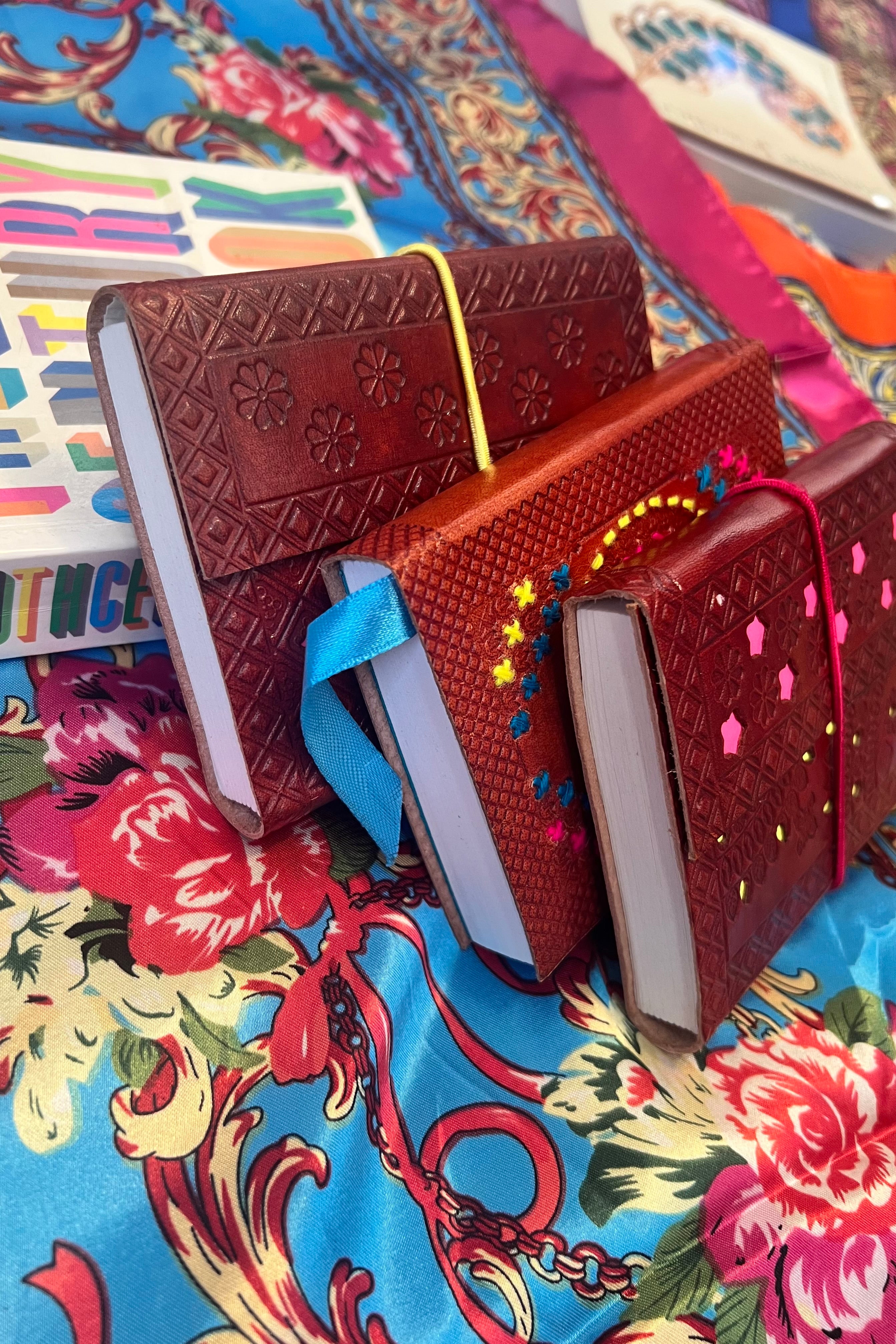 Hand-tooled leather B5 journal with colourful embroidered mandala and sky-blue ribbon - artisan boho notebook.