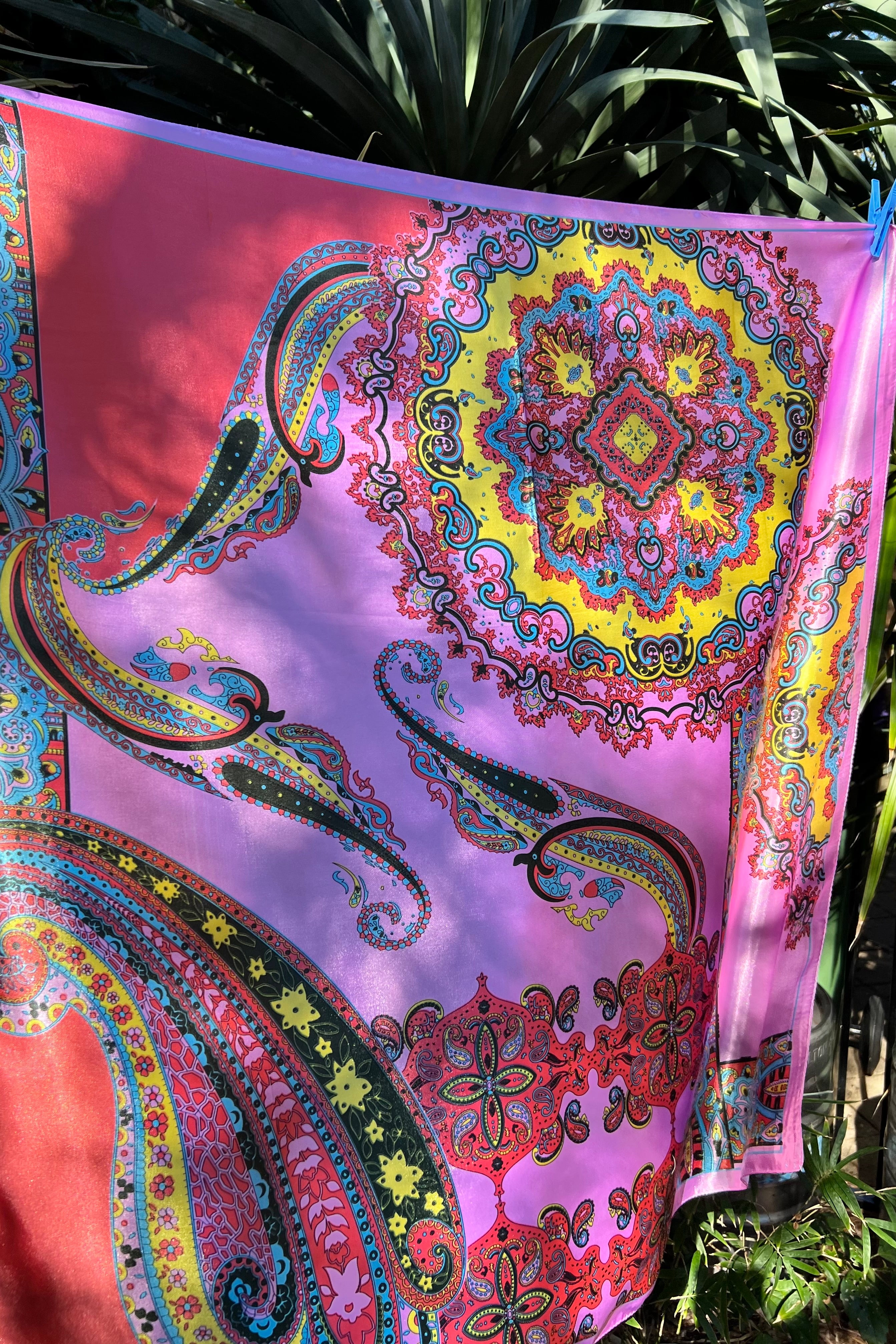 Bright silk satin scarf with paisley and mandala print in lilac, yellow, coral and teal. 90x90cm. Polyester with luxe sheen.