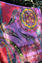 Bright silk satin scarf with paisley and mandala print in lilac, yellow, coral and teal. 90x90cm. Polyester with luxe sheen.