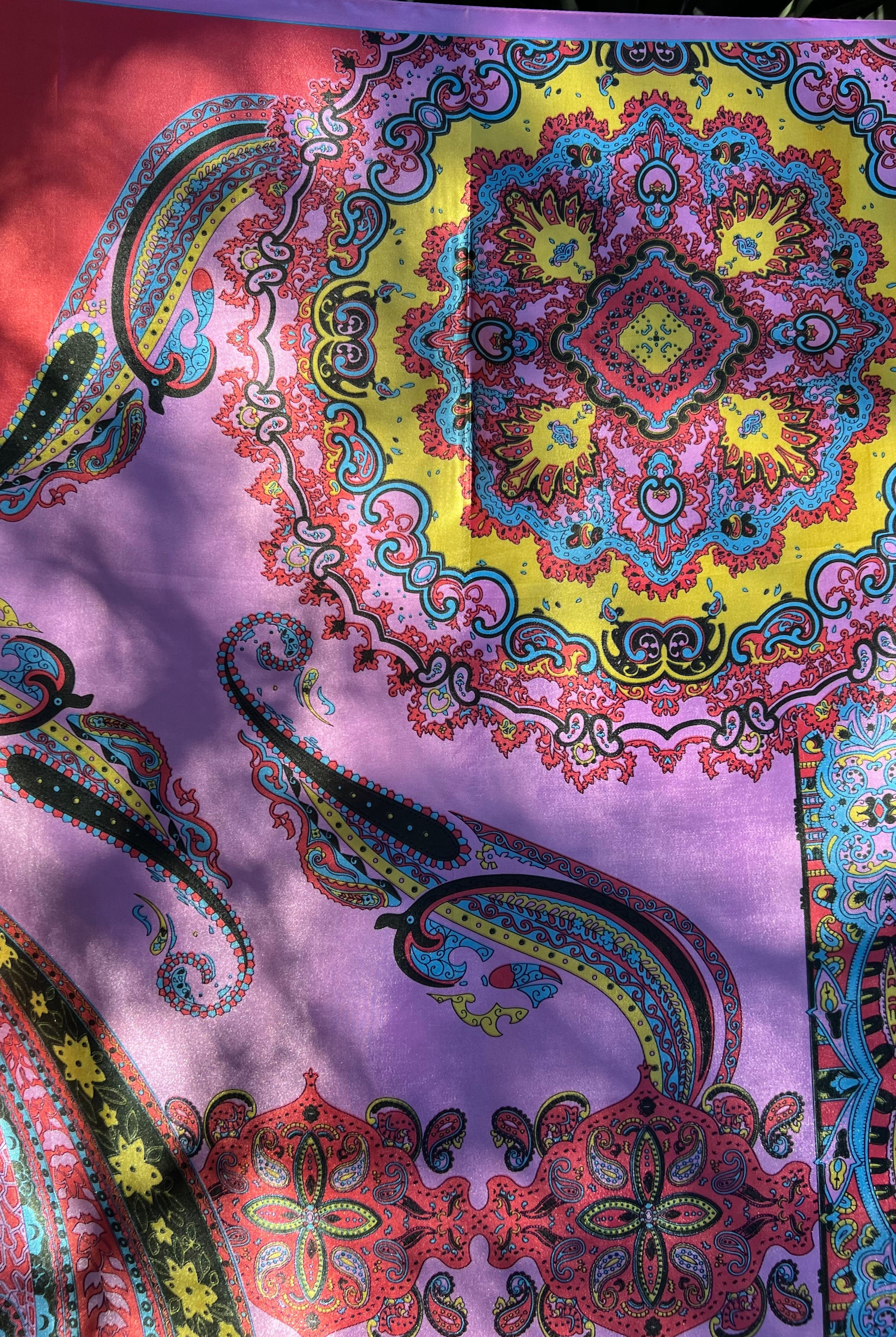Bright silk satin scarf with paisley and mandala print in lilac, yellow, coral and teal. 90x90cm. Polyester with luxe sheen.