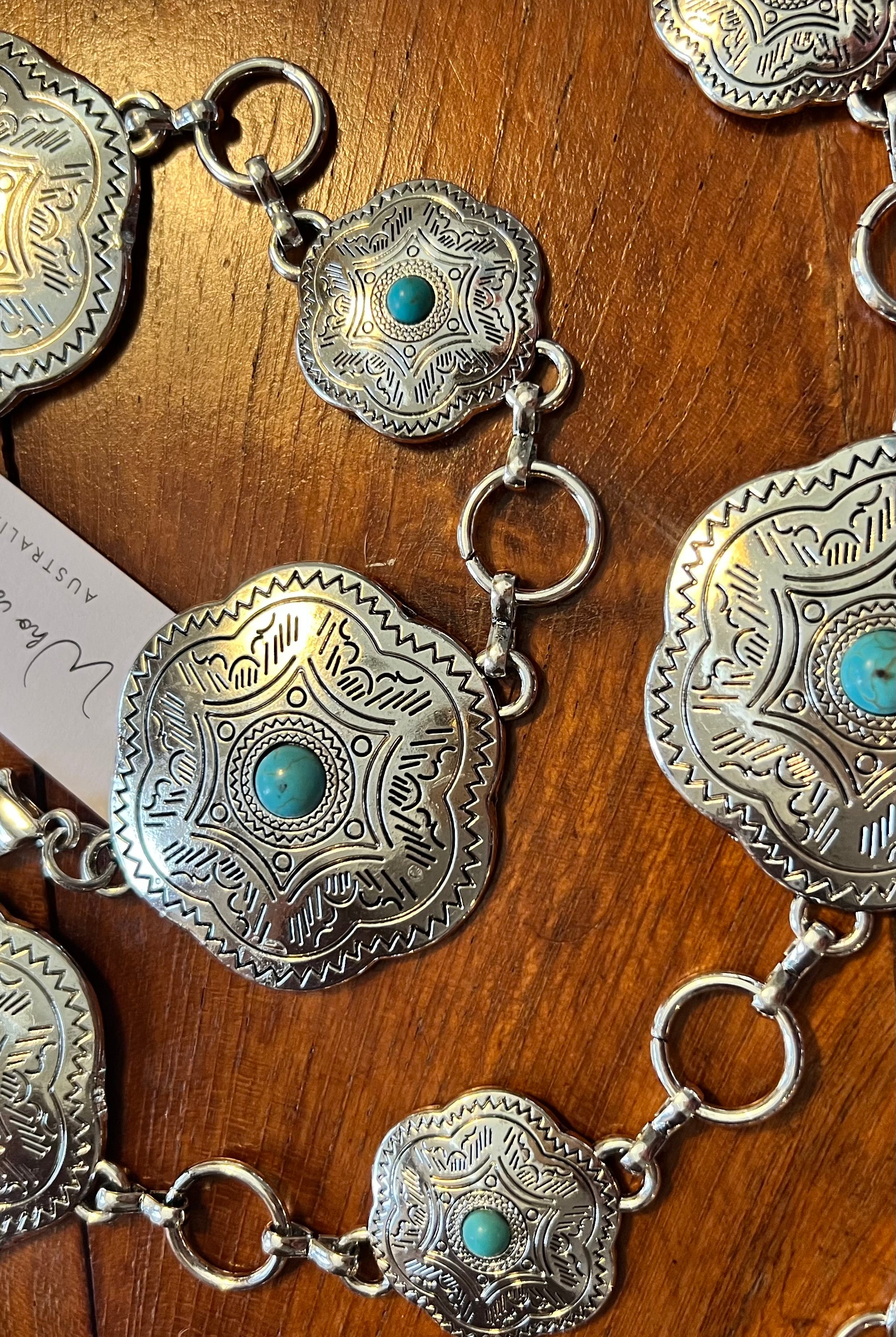 Western festival silver concho chain belt with turquoise stones - boho accessory at Bohemian Love Runway.