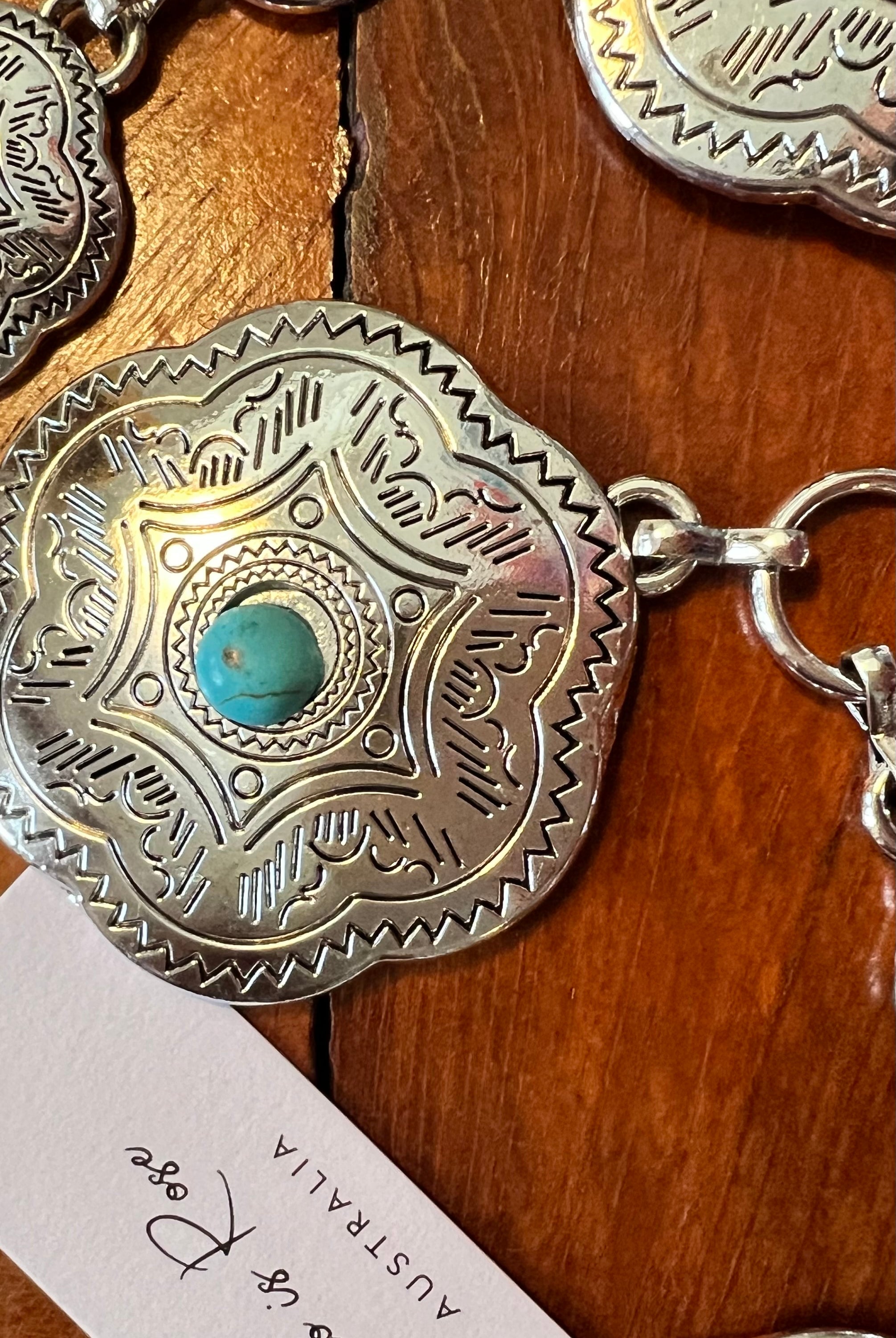 Western festival silver concho chain belt with turquoise stones - boho accessory at Bohemian Love Runway.