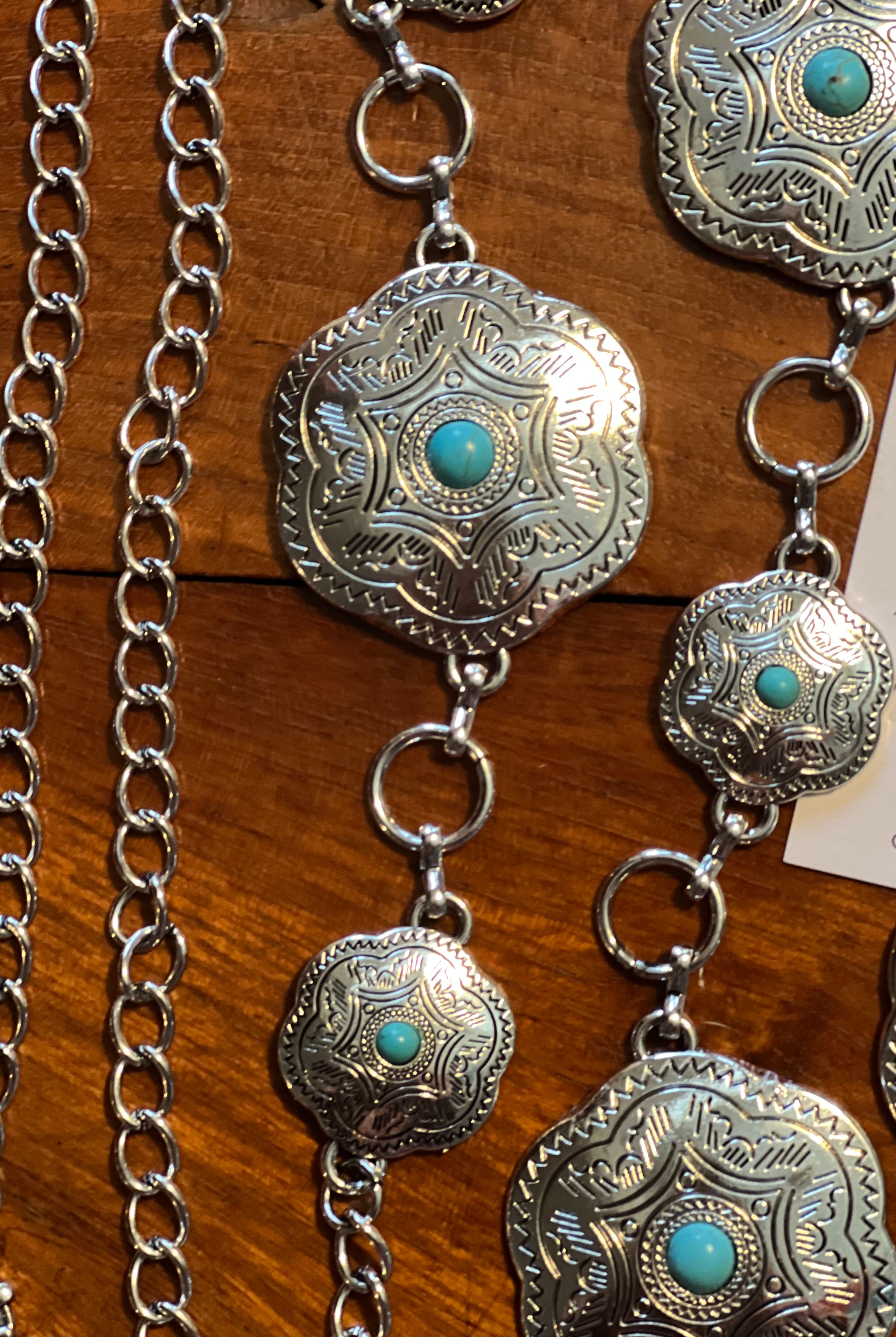 Western festival silver concho chain belt with turquoise stones - boho accessory at Bohemian Love Runway.