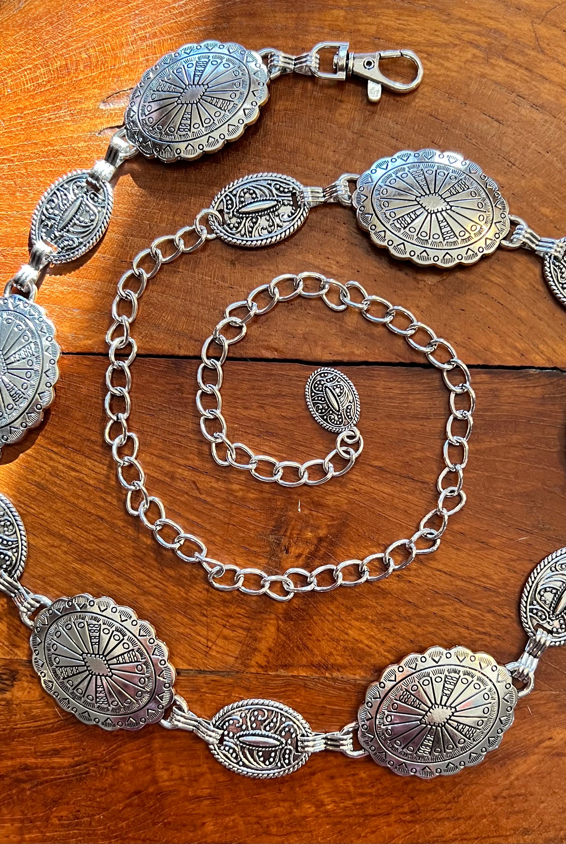Silver finish concho chain belt with engraved oval medallion and extender - boho festival waist belt Australia.