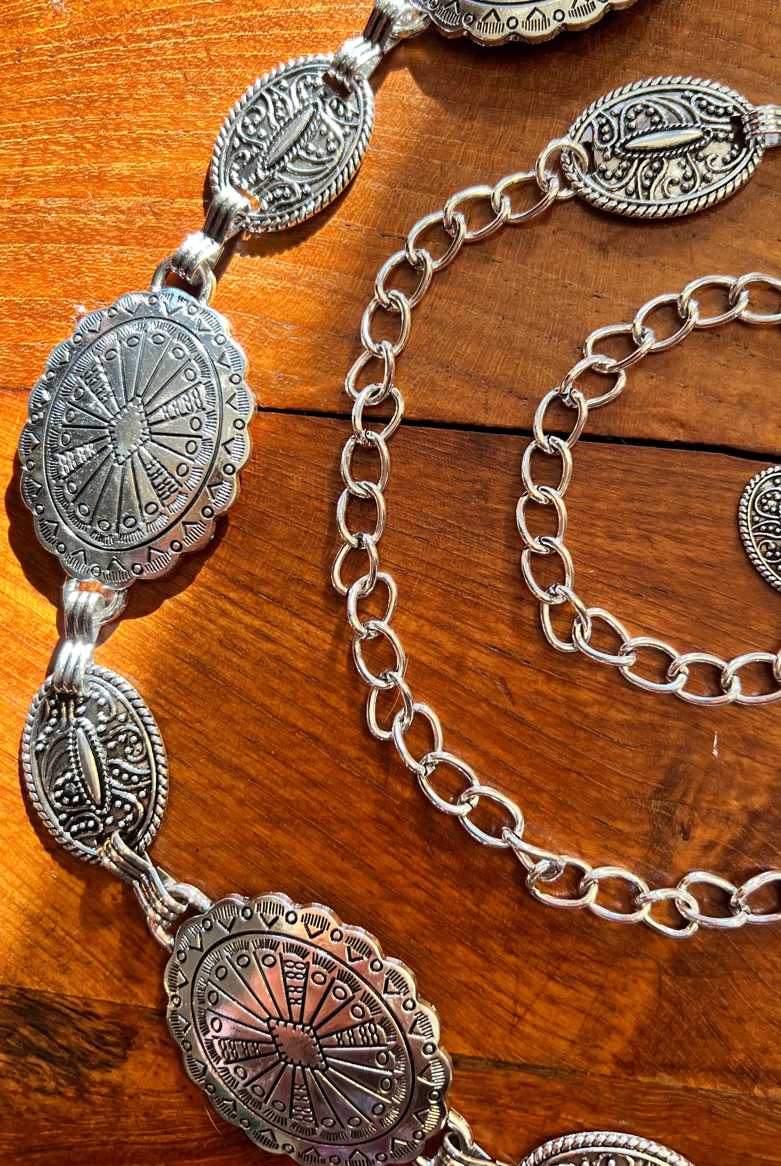 Silver finish concho chain belt with engraved oval medallion and extender - boho festival waist belt Australia.