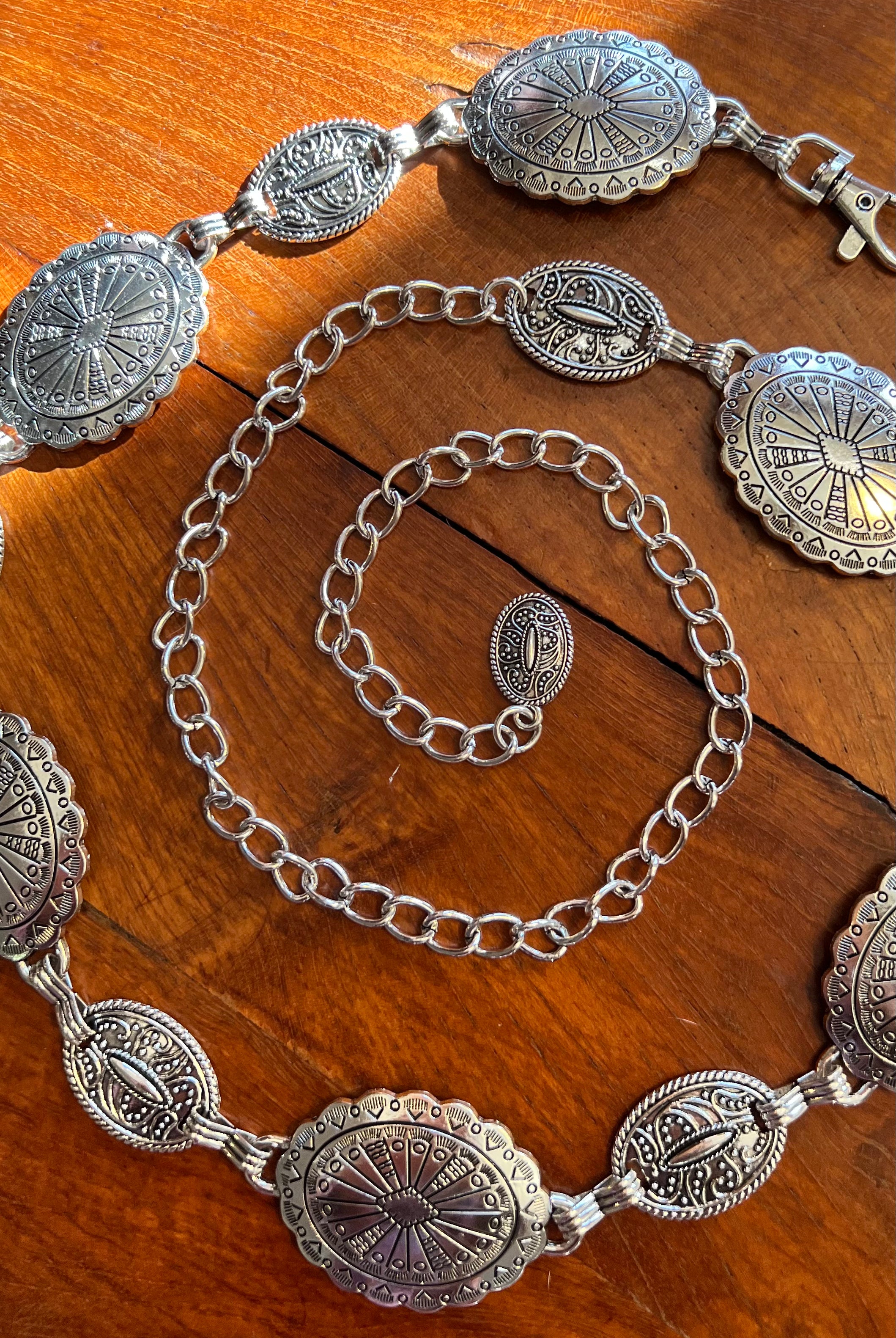 Silver finish concho chain belt with engraved oval medallion and extender - boho festival waist belt Australia.