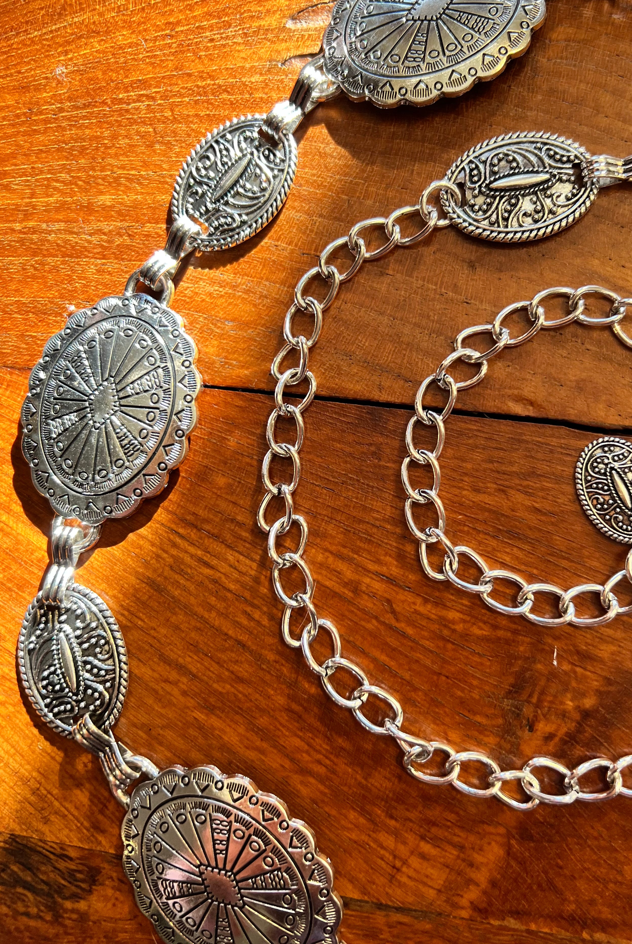Silver finish concho chain belt with engraved oval medallion and extender - boho festival waist belt Australia.