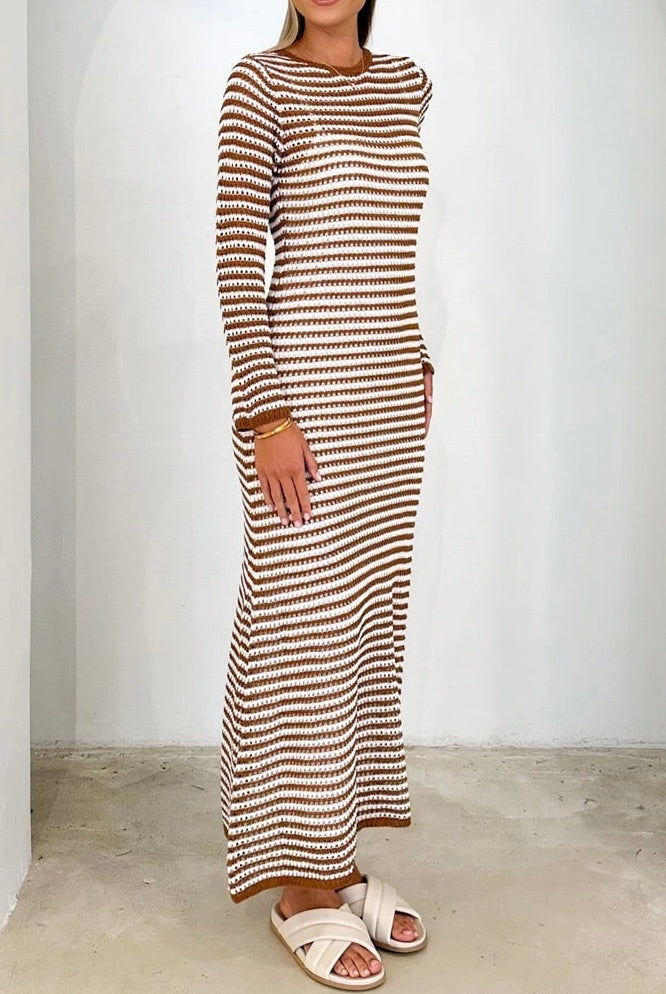 Woman wearing brown and white striped knit maxi dress with long sleeves and round neckline - boho cotton bodycon dress Australia.