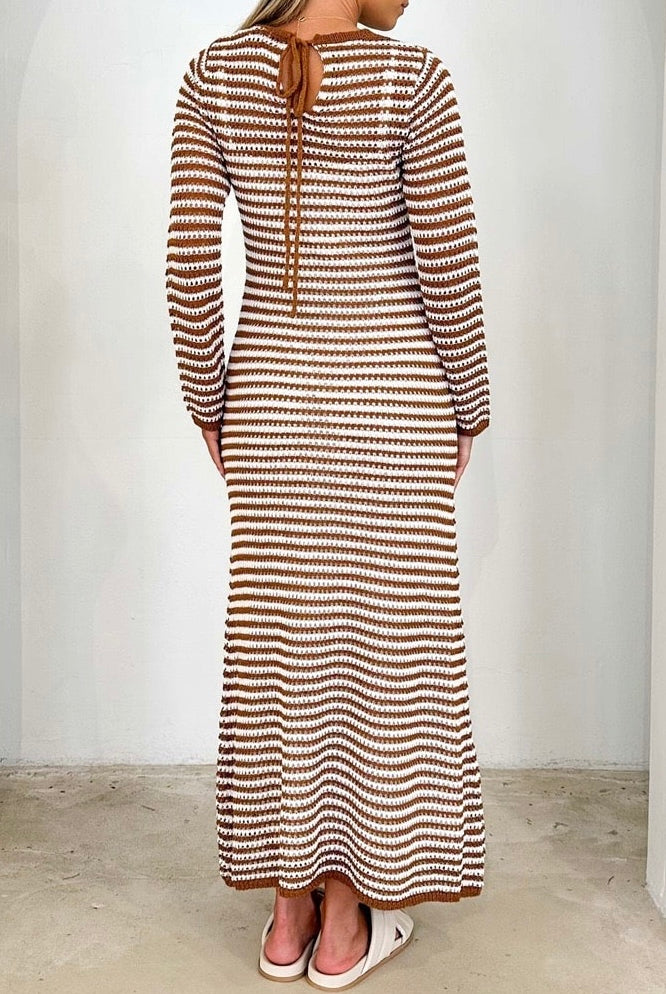 Woman wearing brown and white striped knit maxi dress with long sleeves and round neckline - boho cotton bodycon dress Australia.