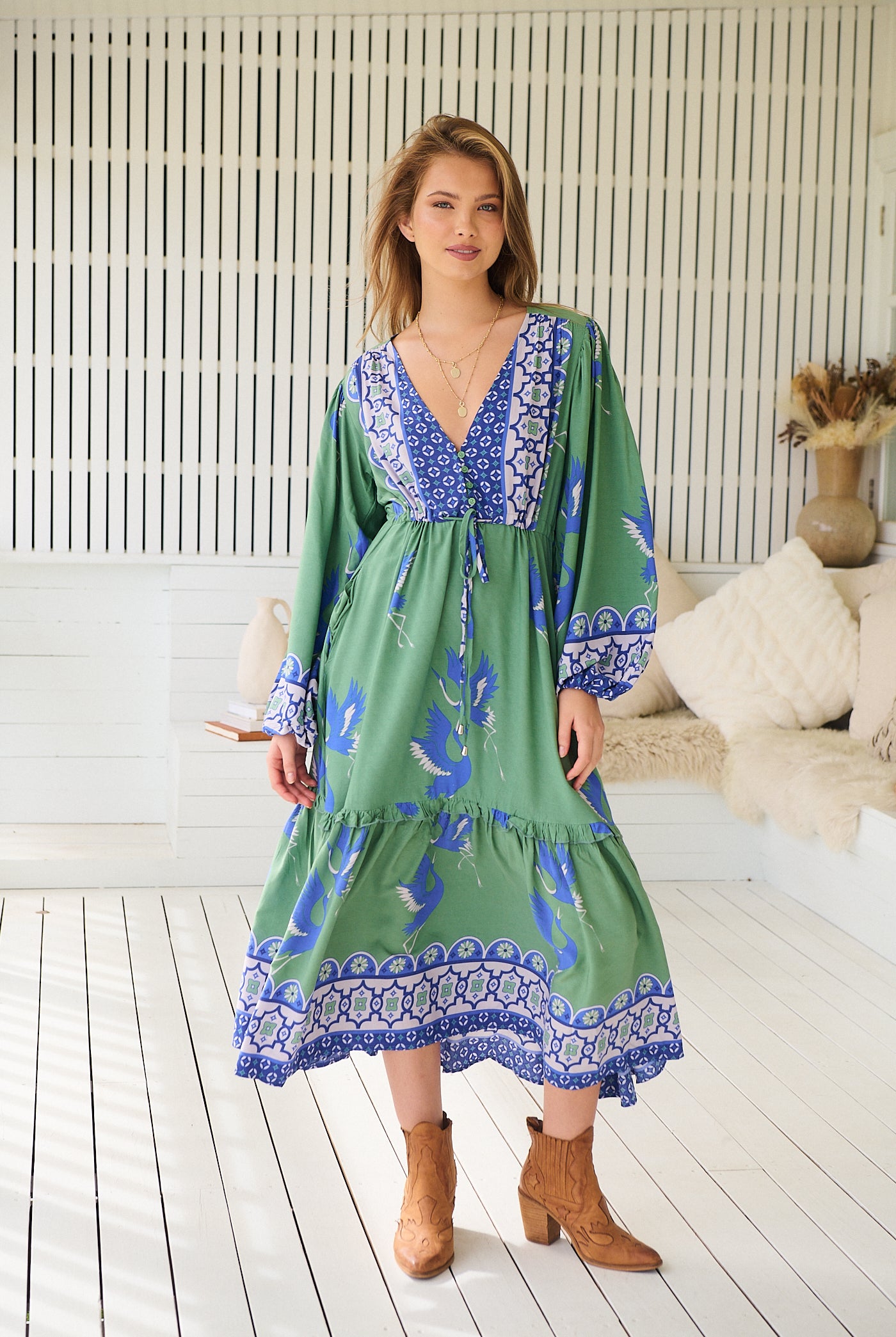 Model wearing Bluebird Willa Boho Midi Dress by Jaase - floral print, long sleeves, 100% rayon, relaxed fit.