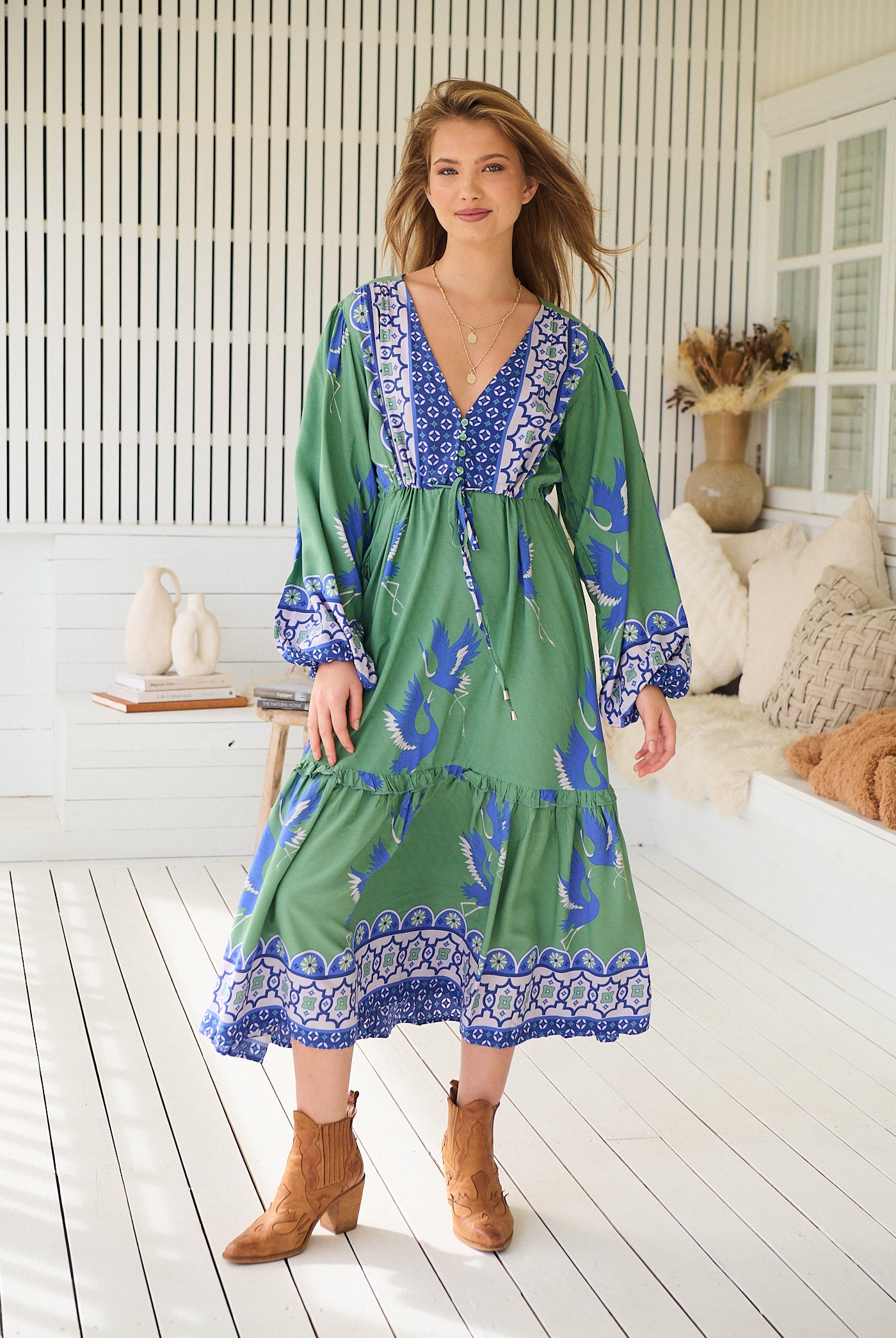 Model wearing Bluebird Willa Boho Midi Dress by Jaase - floral print, long sleeves, 100% rayon, relaxed fit.