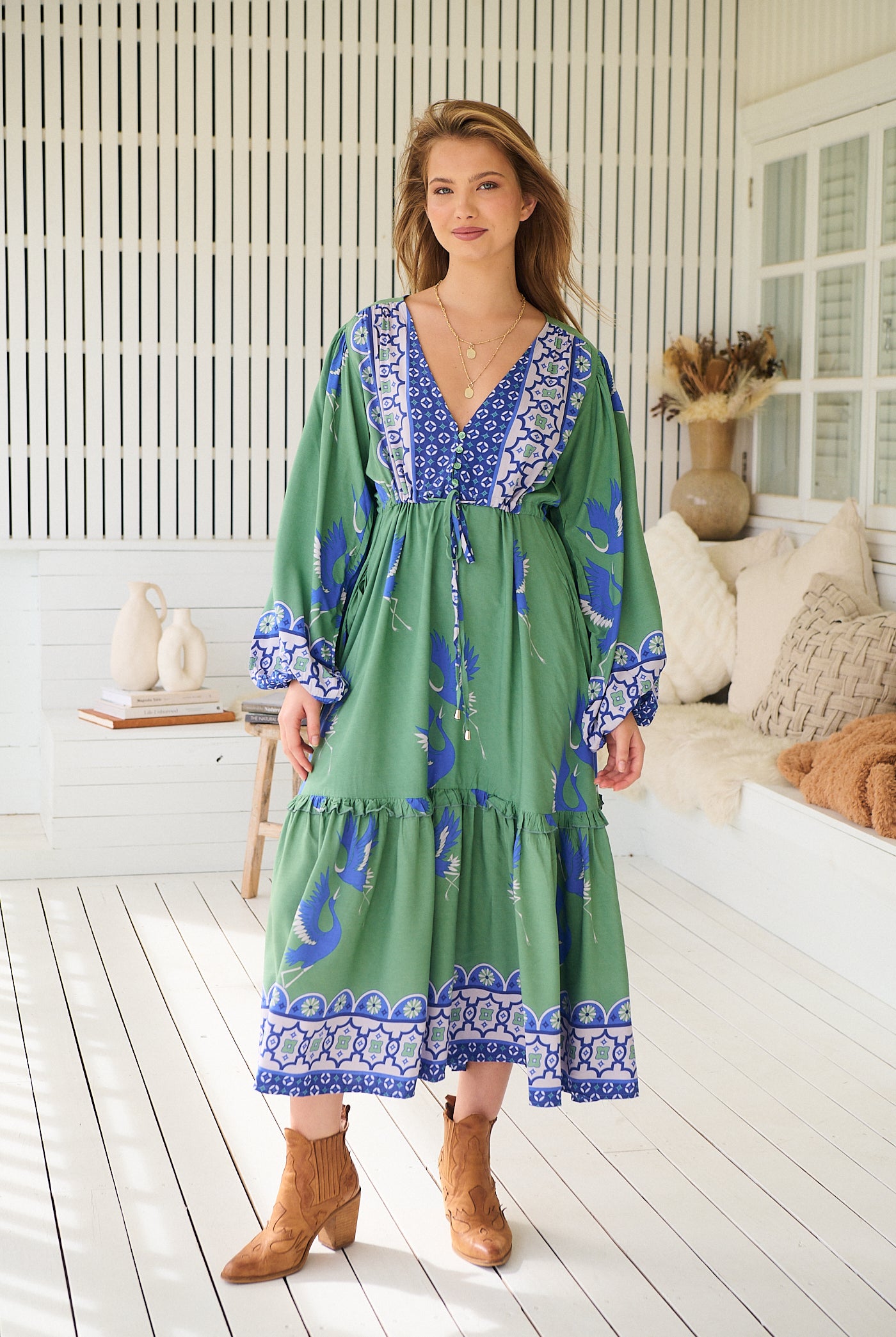 Model wearing Bluebird Willa Boho Midi Dress by Jaase - floral print, long sleeves, 100% rayon, relaxed fit.