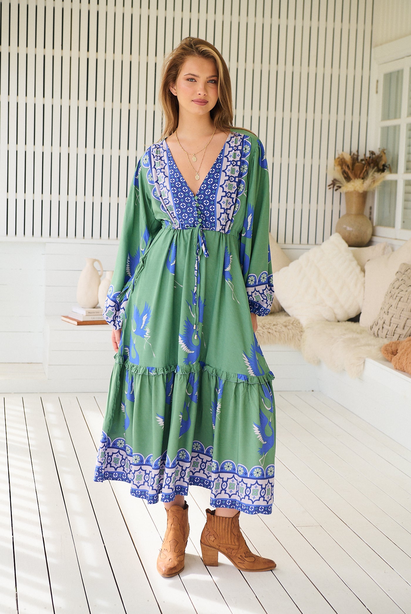 Model wearing Bluebird Willa Boho Midi Dress by Jaase - floral print, long sleeves, 100% rayon, relaxed fit.