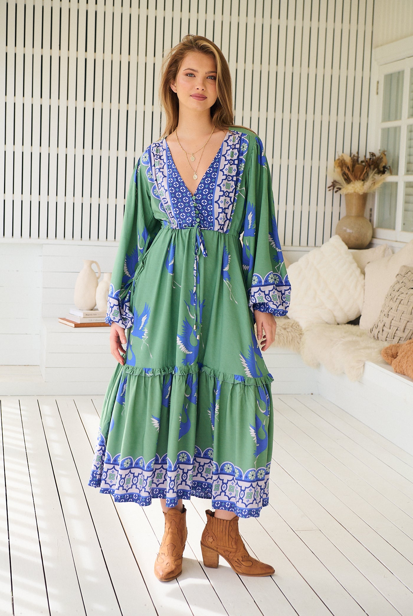 Model wearing Bluebird Willa Boho Midi Dress by Jaase - floral print, long sleeves, 100% rayon, relaxed fit.