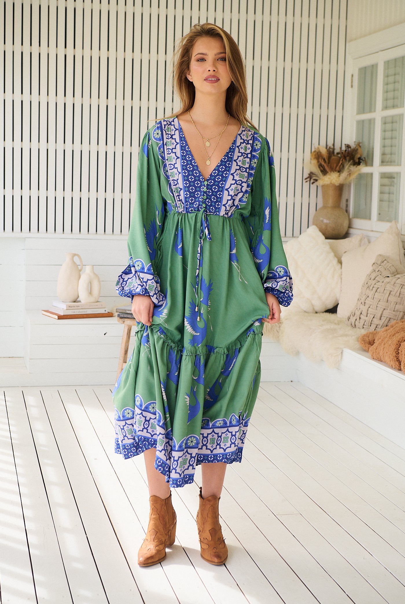 Model wearing Bluebird Willa Boho Midi Dress by Jaase - floral print, long sleeves, 100% rayon, relaxed fit.