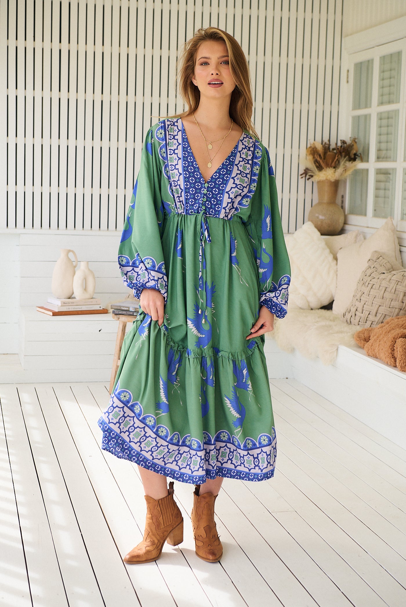 Model wearing Bluebird Willa Boho Midi Dress by Jaase - floral print, long sleeves, 100% rayon, relaxed fit.