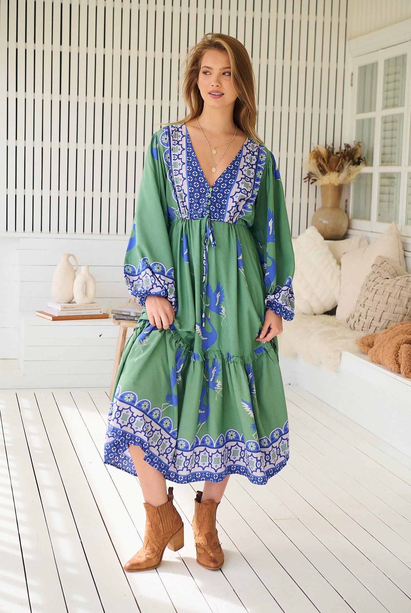 Model wearing Bluebird Willa Boho Midi Dress by Jaase - floral print, long sleeves, 100% rayon, relaxed fit.