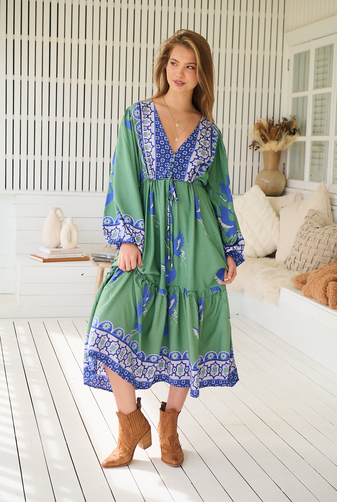 Model wearing Bluebird Willa Boho Midi Dress by Jaase - floral print, long sleeves, 100% rayon, drawstring waist.