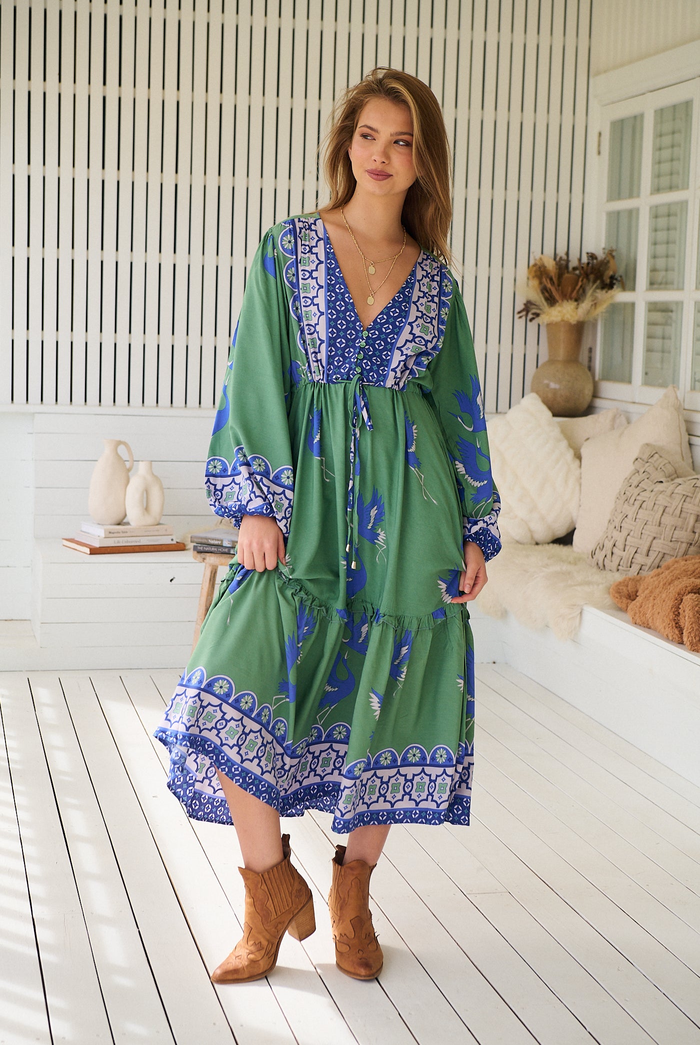 Model wearing Bluebird Willa Boho Midi Dress by Jaase - floral print, long sleeves, 100% rayon, drawstring waist.