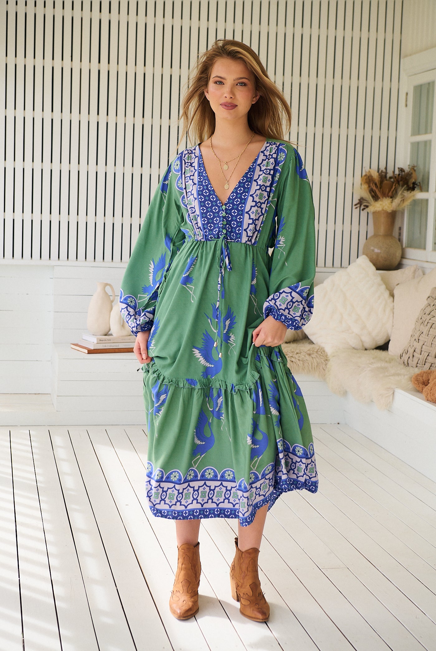 Model wearing Bluebird Willa Boho Midi Dress by Jaase - floral print, long sleeves, 100% rayon, drawstring waist.