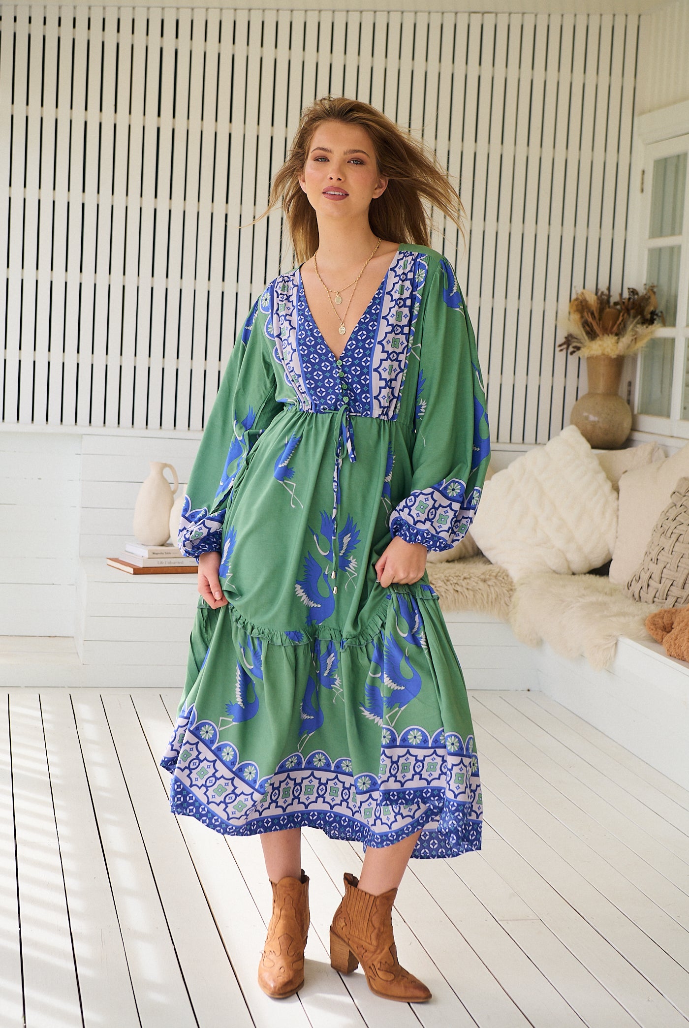 Model wearing Bluebird Willa Boho Midi Dress by Jaase - floral print, long sleeves, 100% rayon, drawstring waist.